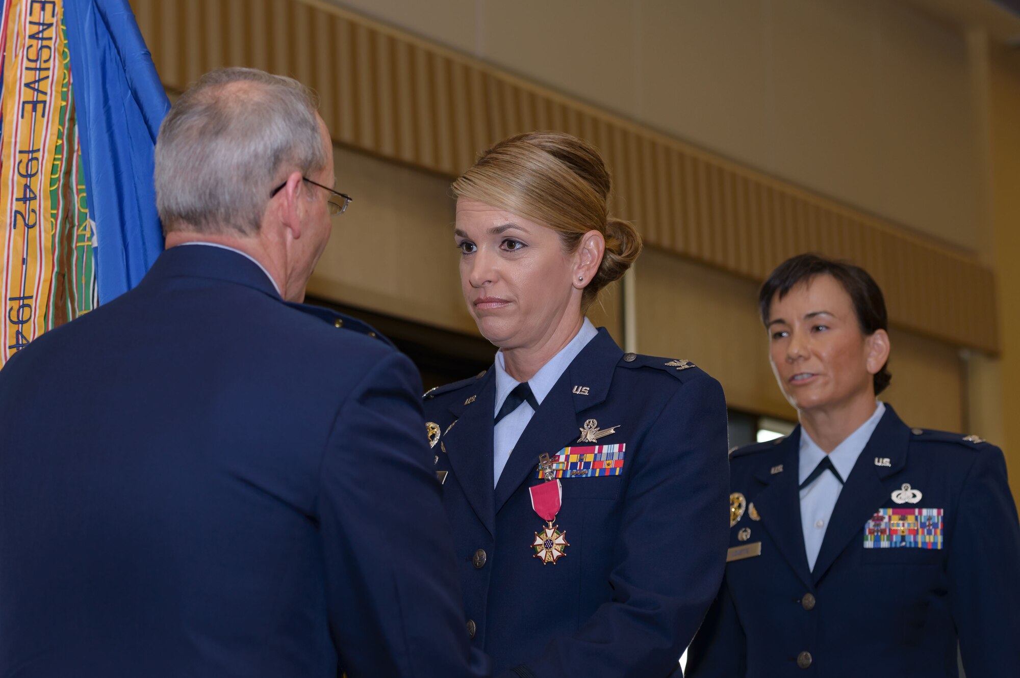 Maj. Gen. Bob LaBrutta, 2nd Air Force commander, takes the guidon from Col. Michele Edmondson, outgoing 81st Training Wing commander, during a change of command ceremony at the Bay Breeze Event Center June 2, 2017, on Keesler Air Force Base, Miss. The ceremony is a symbol of command being exchanged from one commander to the next. Edmondson is now assigned to be the executive officer to the vice chief of staff of the Air Force at the Pentagon in Washington D.C. (U.S. Air Force photo by André Askew) 