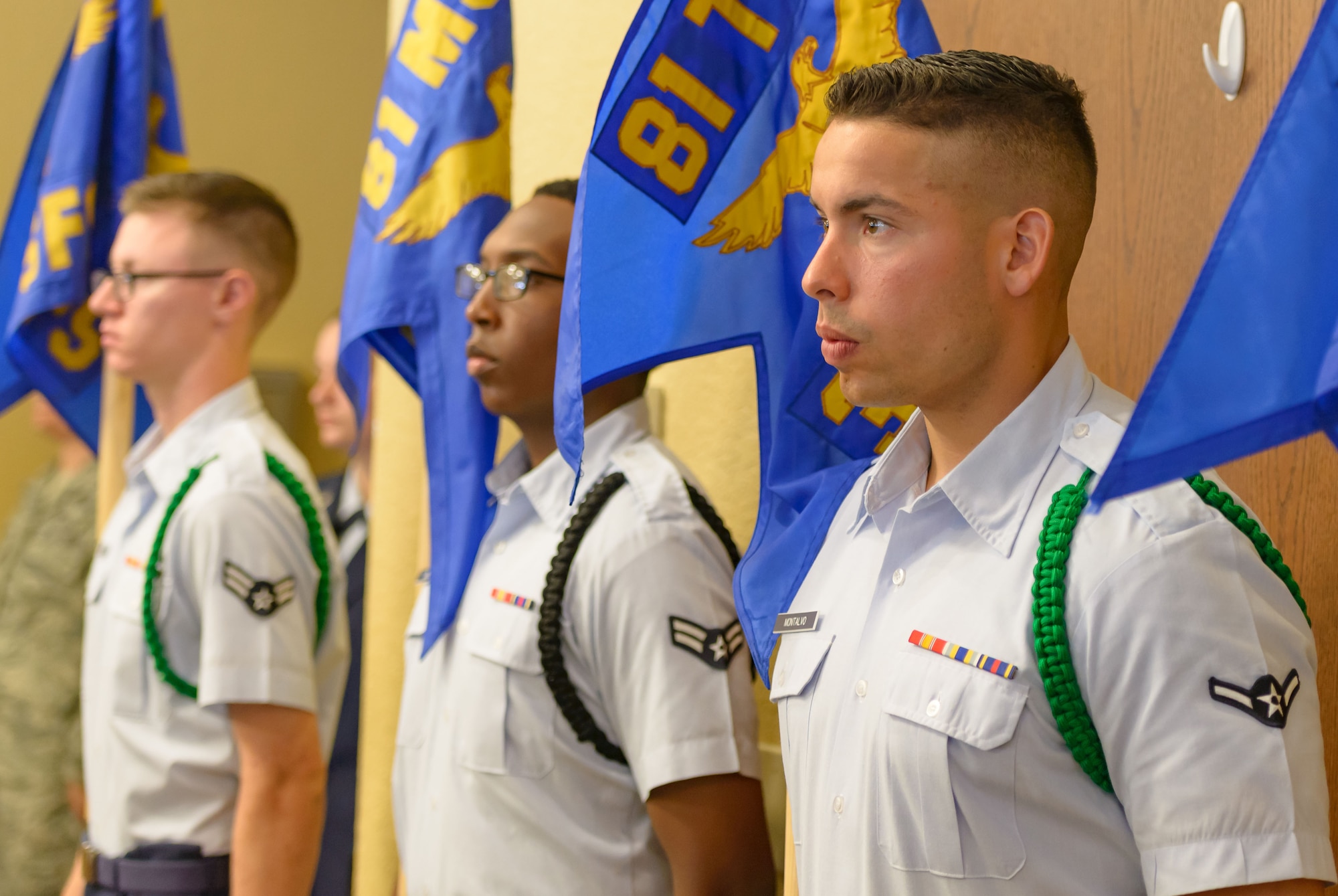Airmen from the 81st Training Group hold Keesler squadron guidons during the 81st Training Wing change of command ceremony at the Bay Breeze Event Center June 2, 2017, on Keesler Air Force Base, Miss. The ceremony is a symbol of command being exchanged from one commander to the next by the handing-off of a ceremonial guidon. (U.S. Air Force photo by André Askew)