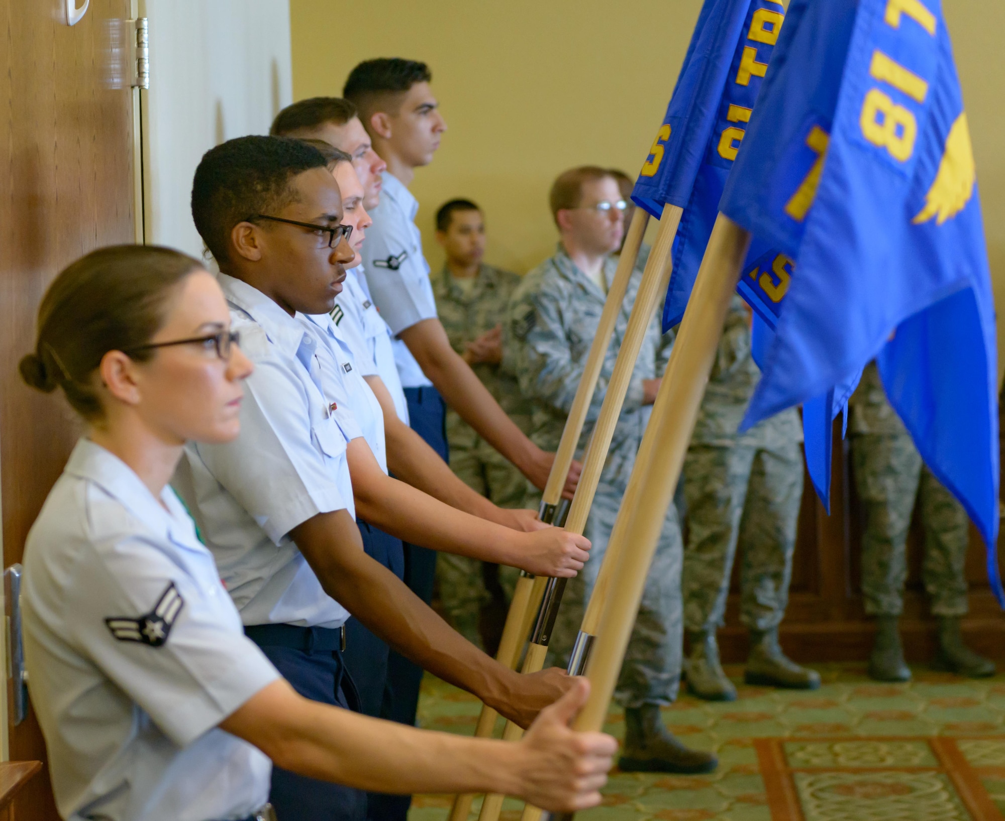 Airmen from the 81st Training Group hold Keesler squadron guidons during the 81st Training Wing change of command ceremony at the Bay Breeze Event Center June 2, 2017, on Keesler Air Force Base, Miss. The ceremony is a symbol of command being exchanged from one commander to the next by the handing-off of a ceremonial guidon. (U.S. Air Force photo by André Askew)