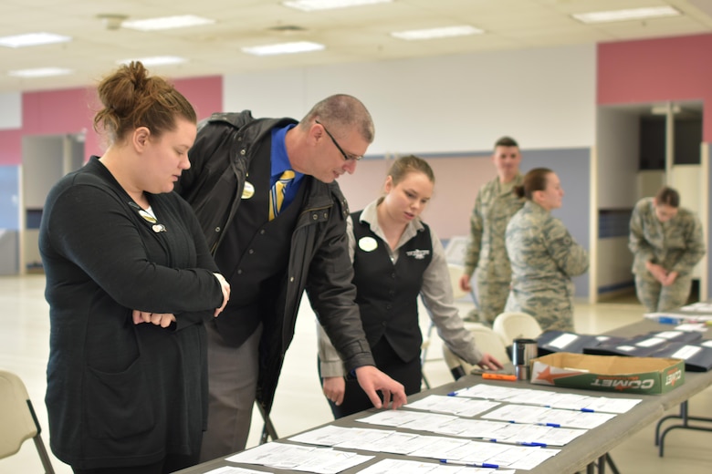 Members from the Goldrush Inn prepare to check-in TDY personnel for the upcoming RED FLAG-Alaska 17-2 exercise May 30, 2017, at Eielson Air Force Base, Alaska. The Goldrush Inn hosts hundreds of people during major exercises several times a year. (U.S. Air Force photo by Alex Bowden)