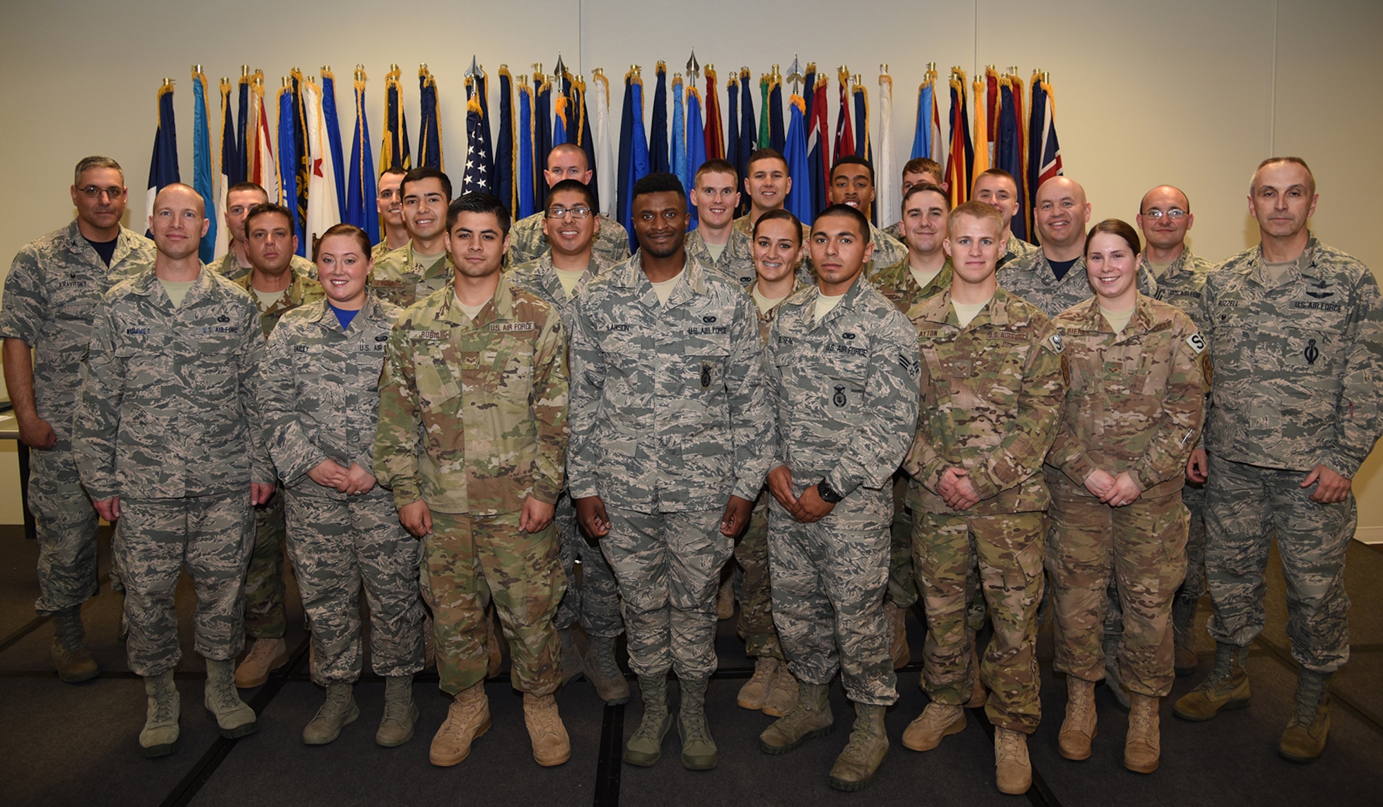 Col. Stephen Kravitsky, 90th Missile Wing commander along with Col. Lloyd Buzzell, 20th Air Force vice commander and Chief Master Sgt. Jeffery Steagall, 90th MW command chief pose for a group photo with enlisted Airmen who promoted in March and April during the wing promotion ceremony on F.E. Warren Air Force Base, Wyo., June 2, 2017. Each month the Mighty Ninety hosts a ceremony to recognize the promotees from the base. (U.S. Air Force photo by Glenn S. Robertson)