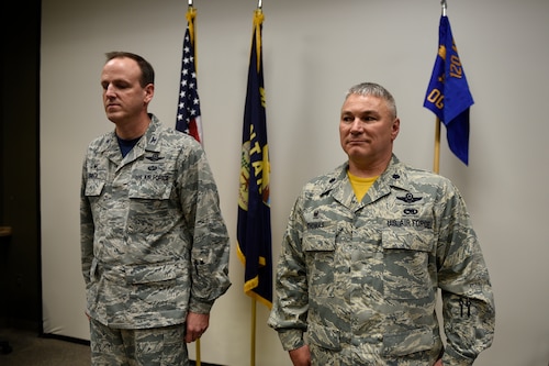 Lt. Col. Trace Thomas, 120th Airlift Wing Operations Group commander, received the 120th OG command guidon from Col. Lee T. Smith, 120th AW commander May 6 during an assumption of command ceremony at the Montana Air National Guard, Great Falls, operations group auditorium. Thomas was previously the 186th Airlift Squadron commander. (U.S. National Guard photo by Staff Sgt. Lindsey Soulsby/Released)