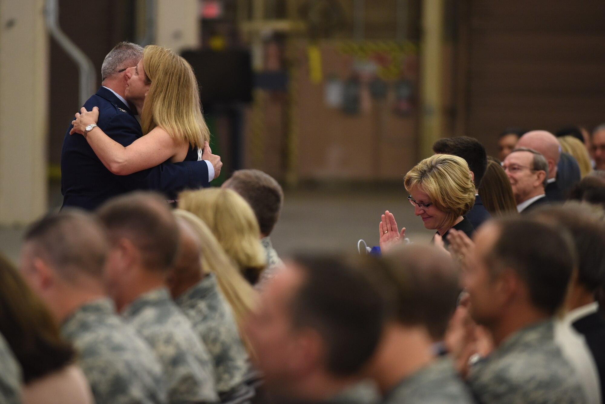 Col. J. Christopher Moss, 30th Space Wing commander, embraces his wife Brenda during his retirement ceremony, June 2, 2017, Vandenberg Air Force Base, Calif. Moss served 26 years in the Air Force, including his last two as commander of the 30th SW. (U.S. Air Force photo by Senior Airman Robert J. Volio/Released)