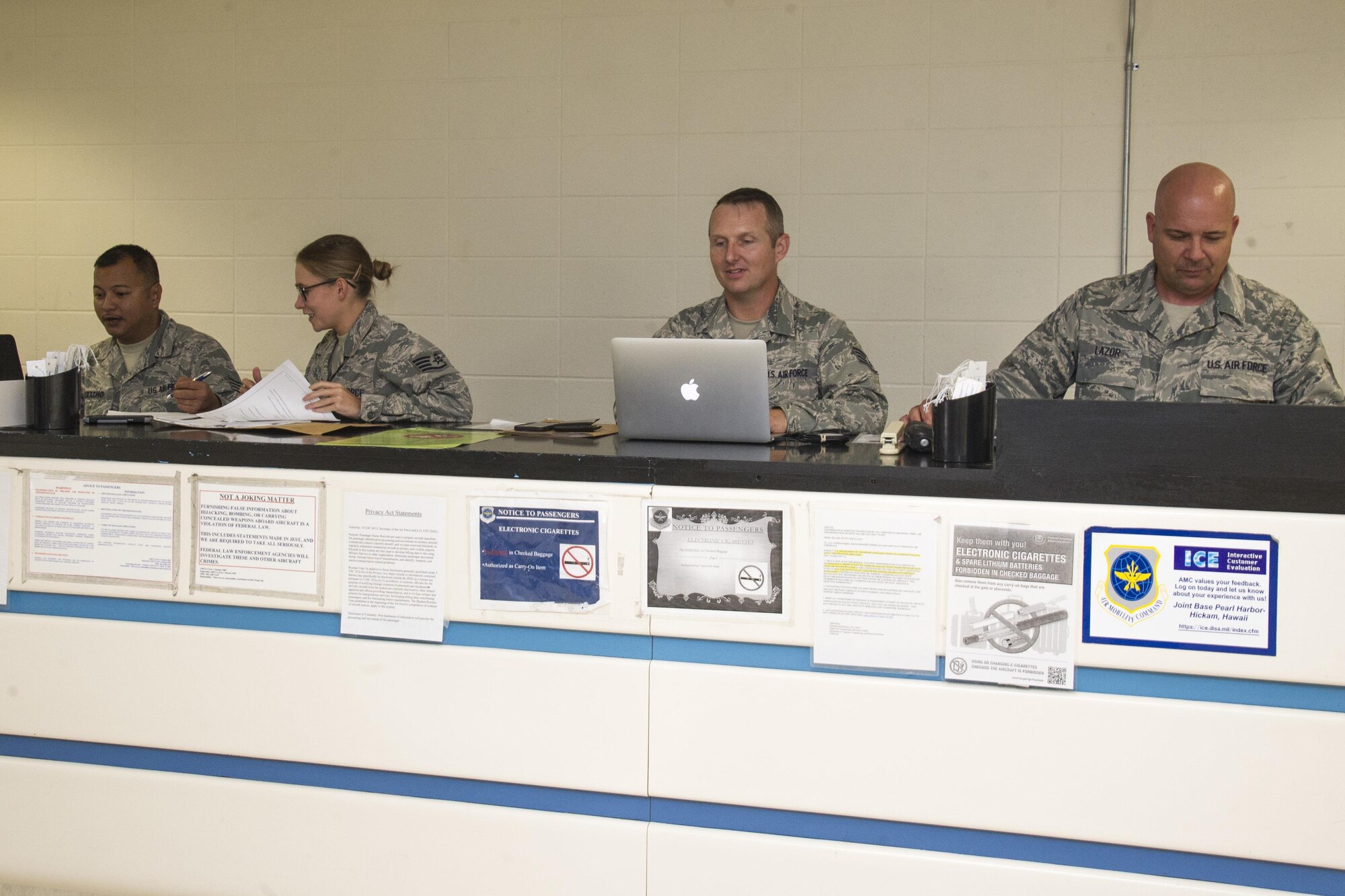 Air Force Reserve Citizen Airmen Staff Sgts. Ken Camacho, of Hagatna, Guam, Jessica Gwinn, of Dover, Del., Chad Vazquez, of Austin, Texas, and Paul Lazor, of Honolulu, Hawaii, air transportation specialists with the 48th Aerial Port Squadron, input passenger information for a Space Available Travel flight at Joint Base Pearl Harbor-Hickam, Hawaii, March 11, 2017. Members of the 48th Aerial Port Squadron support the Space A Travel program during their two-week annual training and monthly unit training assembly. Located on Oahu and a component of the Air Force Reserve, the 48th Aerial Port Squadron provides expertise in all areas of air terminal operations to include aircraft loading, cargo processing and inspecting, passenger services, aircraft fleet services and aerial port command and control. (U.S. Air Force photo by Master Sgt. Theanne K. Herrmann)