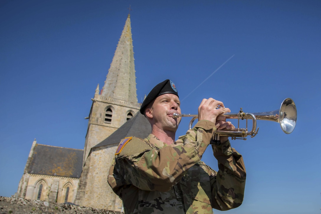 Army Sgt. Jonathan Bosarge performs taps during a ceremony commemorating the 73rd anniversary of D-Day in Picauville, France, June 1, 2017. Army photo by Spc. Joseph Agacinski