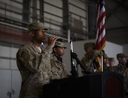 Senior Airman Calvin Johnson, 455th Expeditionary Security Forces Squadron, sings the national anthem during a change of command ceremony at Bagram Airfield, Afghanistan, June 3, 2017. During the ceremony, Brig. Gen. Jim Sears relinquished command of the 455th Air Expeditionary Wing to Brig. Gen. Craig Baker. (U.S. Air Force photo by Staff Sgt. Benjamin Gonsier)