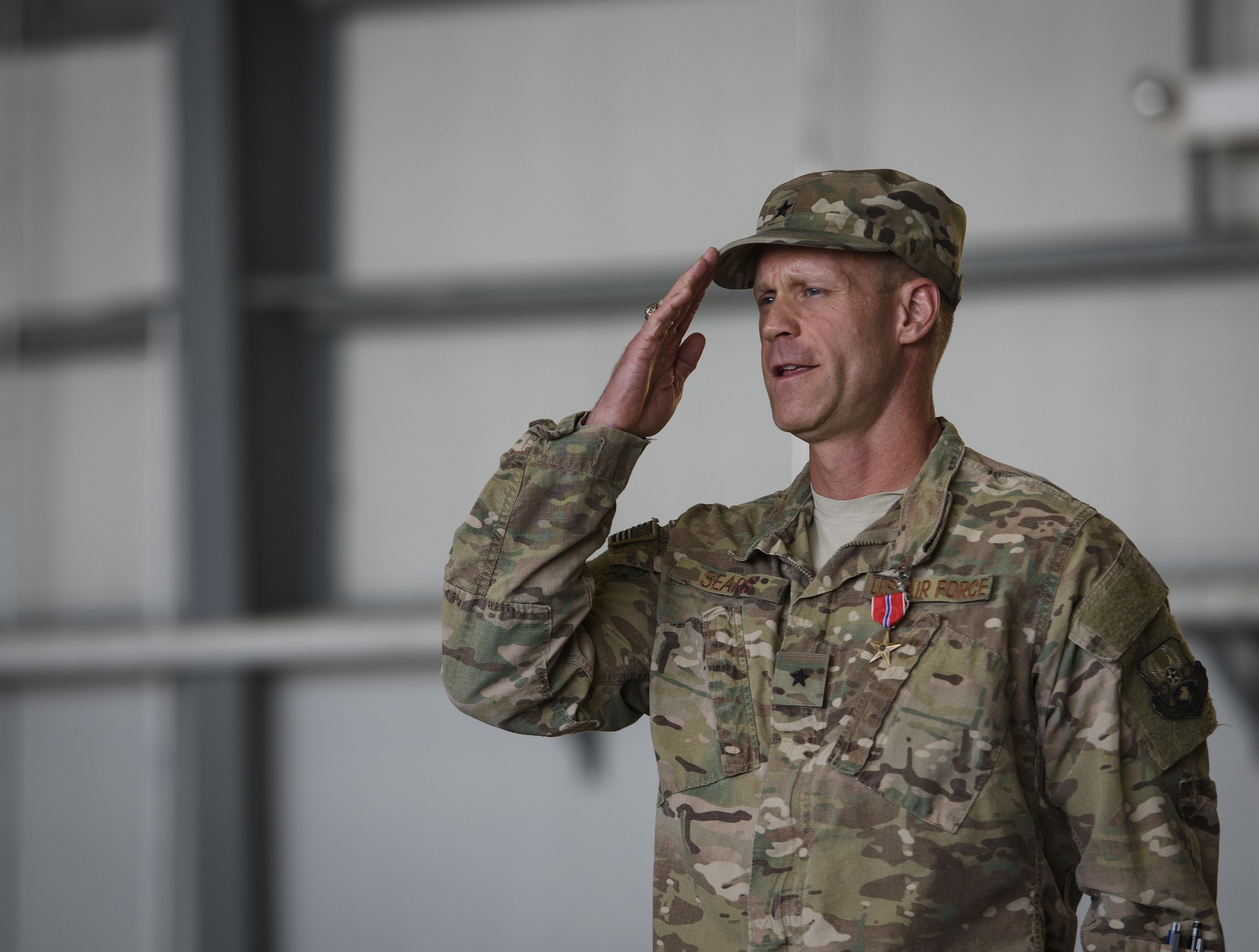 Brig. Gen. Jim Sears renders his final salute as the 455th Air Expeditionary Wing commander during a change of command ceremony at Bagram Airfield, Afghanistan, June 3, 2017. Sears commanded the 455th AEW for the last 12 months. During his time at Bagram, Sears’ leadership enabled 15,800 combat sorties, accumulating to 102,877 combat hours, which resulted in more than 1,369 kinetic strike and 2,836 enemies killed in action. (U.S. Air Force photo by Staff Sgt. Benjamin Gonsier) 