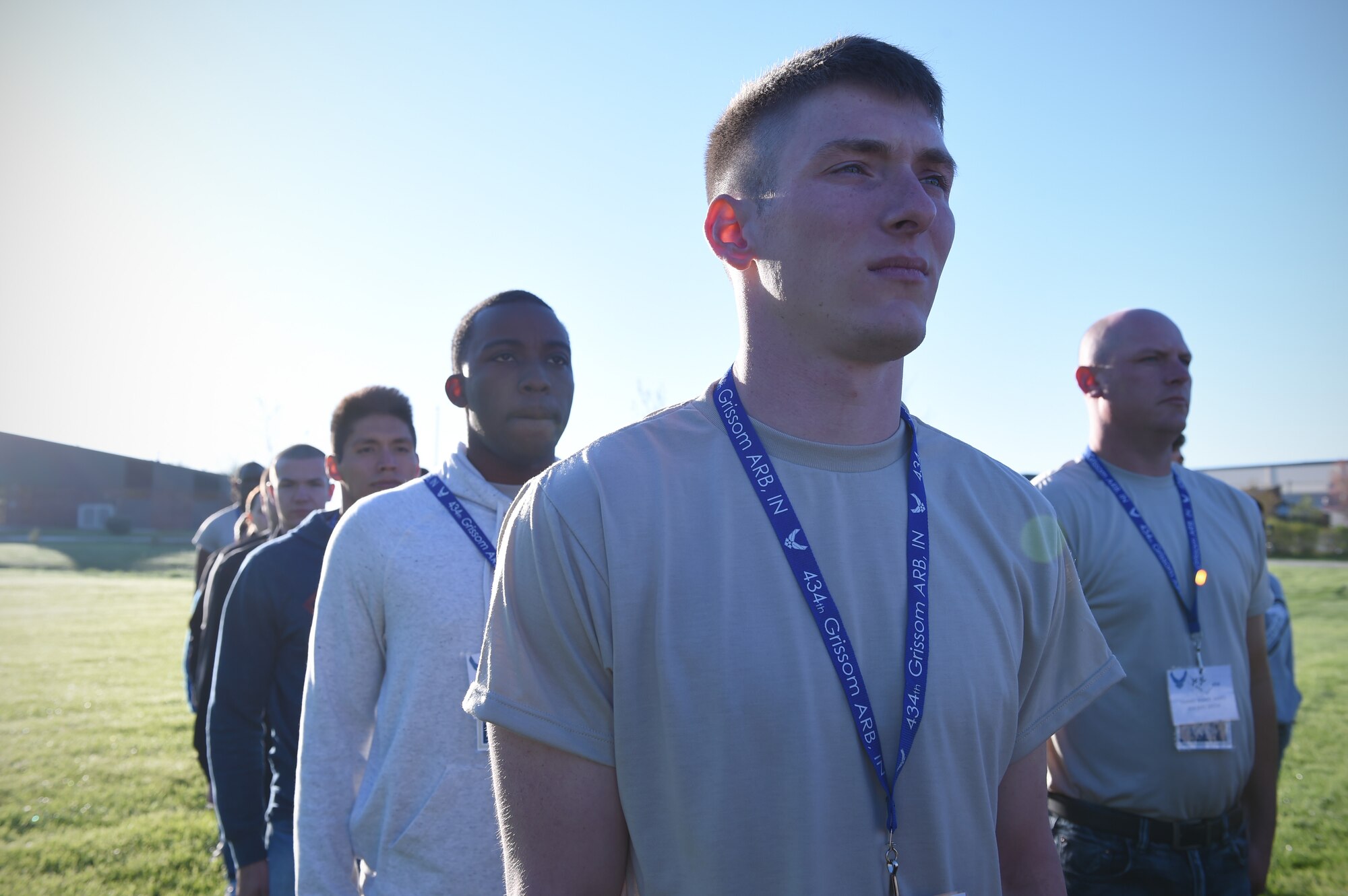 Trainee Travis Bryson (center), 434th Force Support Squadron Development and Training Flight Program member, stands at attention during morning Reveille at Grissom Air Reserve Base, Ind., April 23, 2017. Bryson, along with Jonah Douglas, (center, left), Meza Navarro (second from left) and James Bishop (right) are all members of the 434th FSS Development and Training Flight Program, a program that prepares trainees for Air Force Basic Military Training. (U.S. Air Force photo/Staff Sgt. Katrina Heikkinen)