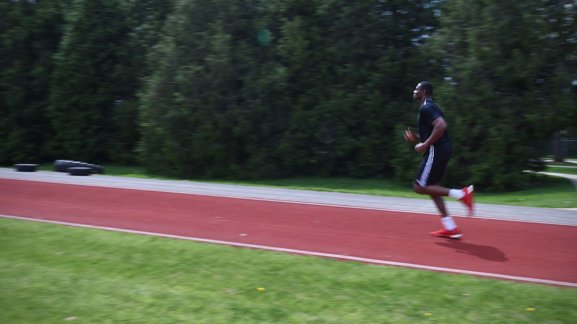 Trainee Akinyemo Solanke, 434th Force Support Squadron Development and Training Flight Program member, pushes through the 1.5-mile portion of a mock Air Force physical fitness assessment at Grissom Air Reserve Base, Ind., April 22, 2017. A typical weekend of D&TF includes dress and appearance inspections, mock PT tests, knowledge studying, customs and courtesies and drill lessons. (U.S. Air Force photo/Staff Sgt. Katrina Heikkinen)