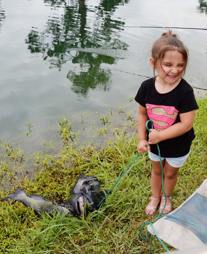 Three-year old Kinsley Snider catches three “monster” fish at Marine Corps Logistics Base Albany’s annual Buddy Fishing Tournament, June 3. Kinsley’s 10.1 pound catfish, earned her a trophy for the largest fish in her age category. The event, which is held at the installation’s Covella Pond, is opened to the communities’ youngest anglers and their fishing buddies.