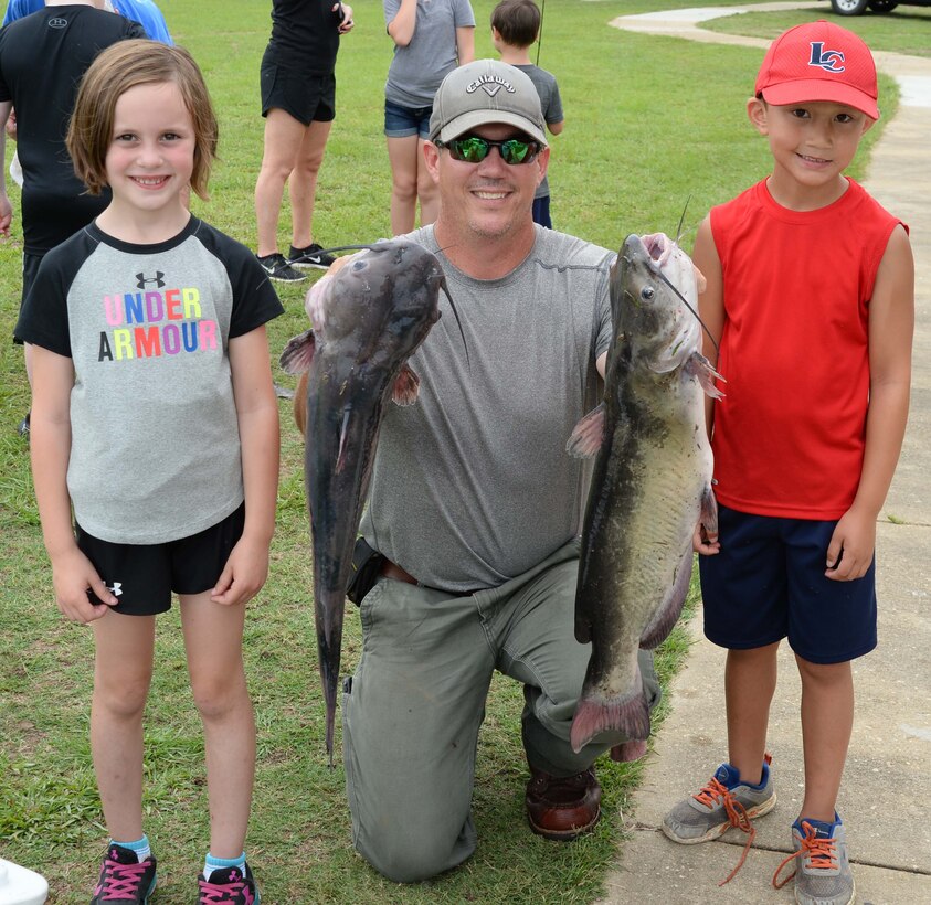 Trophy winner Joseph Paul (right) catches one of Covella Ponds’ “monster” fish at Marine Corps Logistics Base Albany’s annual Buddy Fishing Tournament, June 3. Joseph’s 10.5 pound catfish, earned him two trophies—one for the largest fish in his age category, and a second trophy for overall largest fish of the day. The event, which is held at the installation’s Covella Pond, is opened to the communities’ youngest anglers and their fishing buddies.