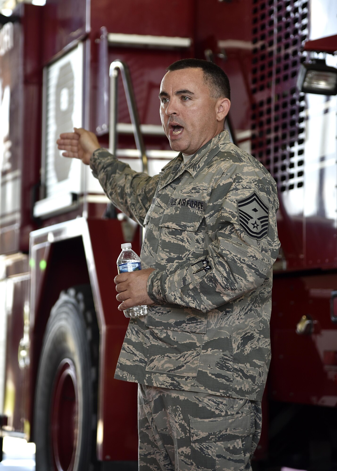 Air Force Senior Master Sgt. Larry Norman, first sergeant, speaks to members of the Office of Cost Assessment and Program Evaluation June 1, 2017, in the fire station at Warfield Air National Guard Base, Md. The Office of CAPE was established as part of the Weapons System Acquisition Reform Act in 2009. (U.S. Air National Guard photo by Airman Sarah M. McClanahan /Released Master Sgt. Chris Schepers)