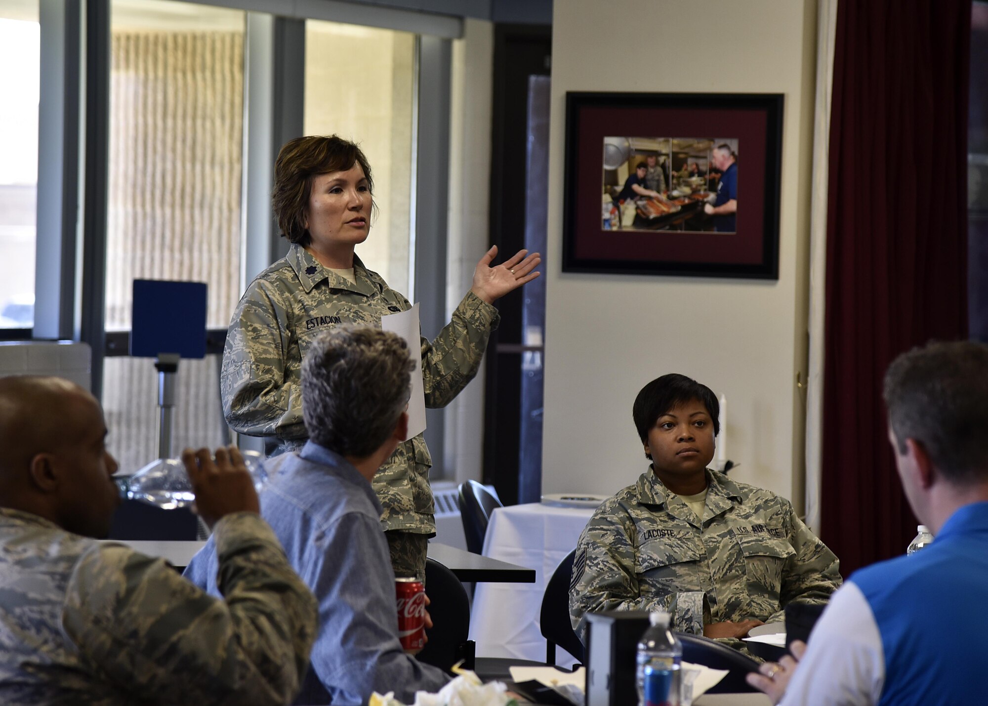 Air Force Lt. Col. Christine G. Estacion, medical service corps officer of 175th Medical Group, speaks to members of the Office of Cost Assessment and Program Evaluation June 1, 2017, in the dining facility at Warfield Air National Guard Base, Md. Estacion was answering CAPE member questions during a working lunch. (U.S. Air National Guard photo by Airman Sarah M. McClanahan /Released Master Sgt. Chris Schepers)