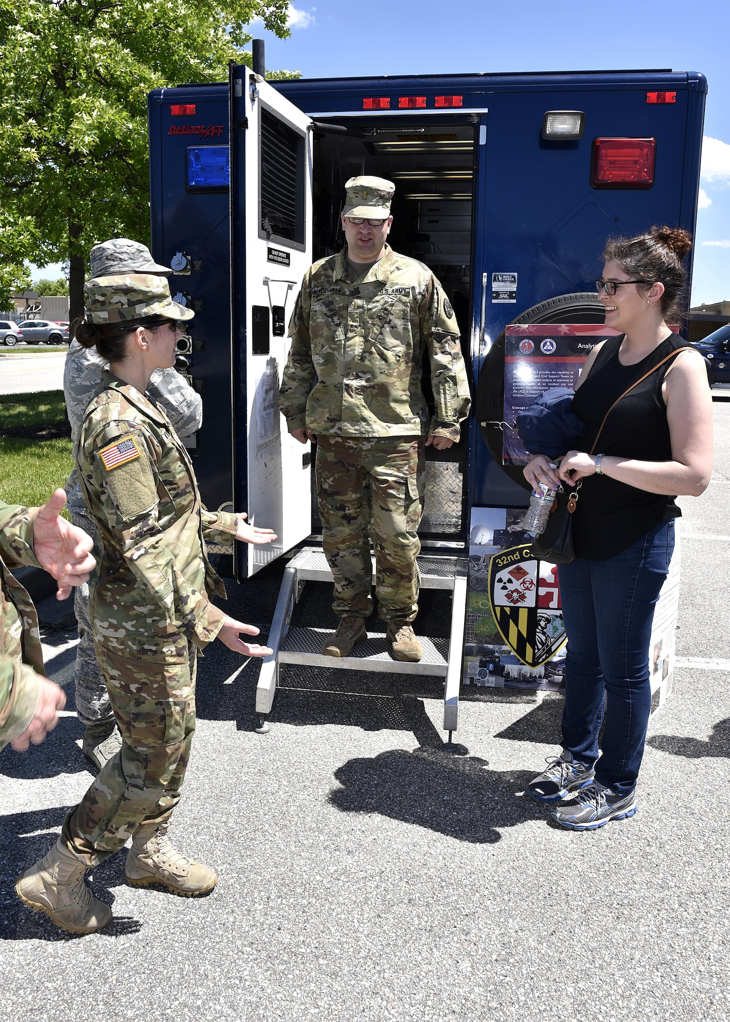 Service members speak to a member of the Office of Cost Assessment and Program Evaluation June 1, 2017, at Warfield Air National Guard Base, Md. (U.S. Air National Guard photo by Airman Sarah M. McClanahan /Released Master Sgt. Chris Schepers)