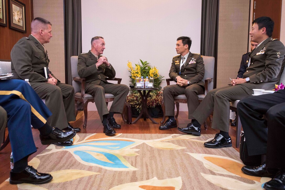 Marine Corps Gen. Joe Dunford, chairman of the Joint Chiefs of Staff, speaks with Singapore chief of staff, Army Lt. Gen. Perry Lim Cheng Yeow, during a bilateral meeting at  the Shangri-La Dialogue in Singapore, June 3, 2017. DoD photo by Navy Petty Officer 2nd Class Dominique A. Pineiro