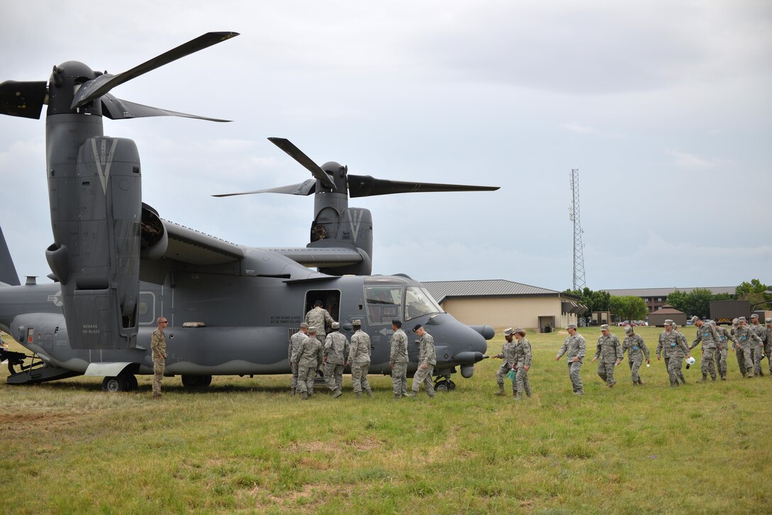 17th Training Wing students tour a CV-22 Osprey assigned to the 20th Special Operations Squadron, Goodfellow Air Force Base, Texas, May 30, 2017. The visit gave students a hands-on experience, allowing them to have a real-world picture of their job in the operational Air Force. (U.S. Air Force Photo by James R. Orlando/Released)