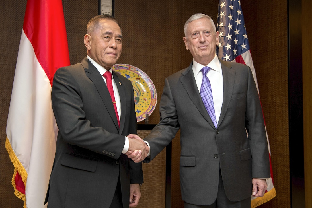 Defense Secretary Jim Mattis shakes hands with Indonesian Defense Minister Ryamizard Ryacudu during the Shangri-La Dialogue in Singapore, June 3, 2017. DoD photo by Air Force Staff Sgt. Jette Carr