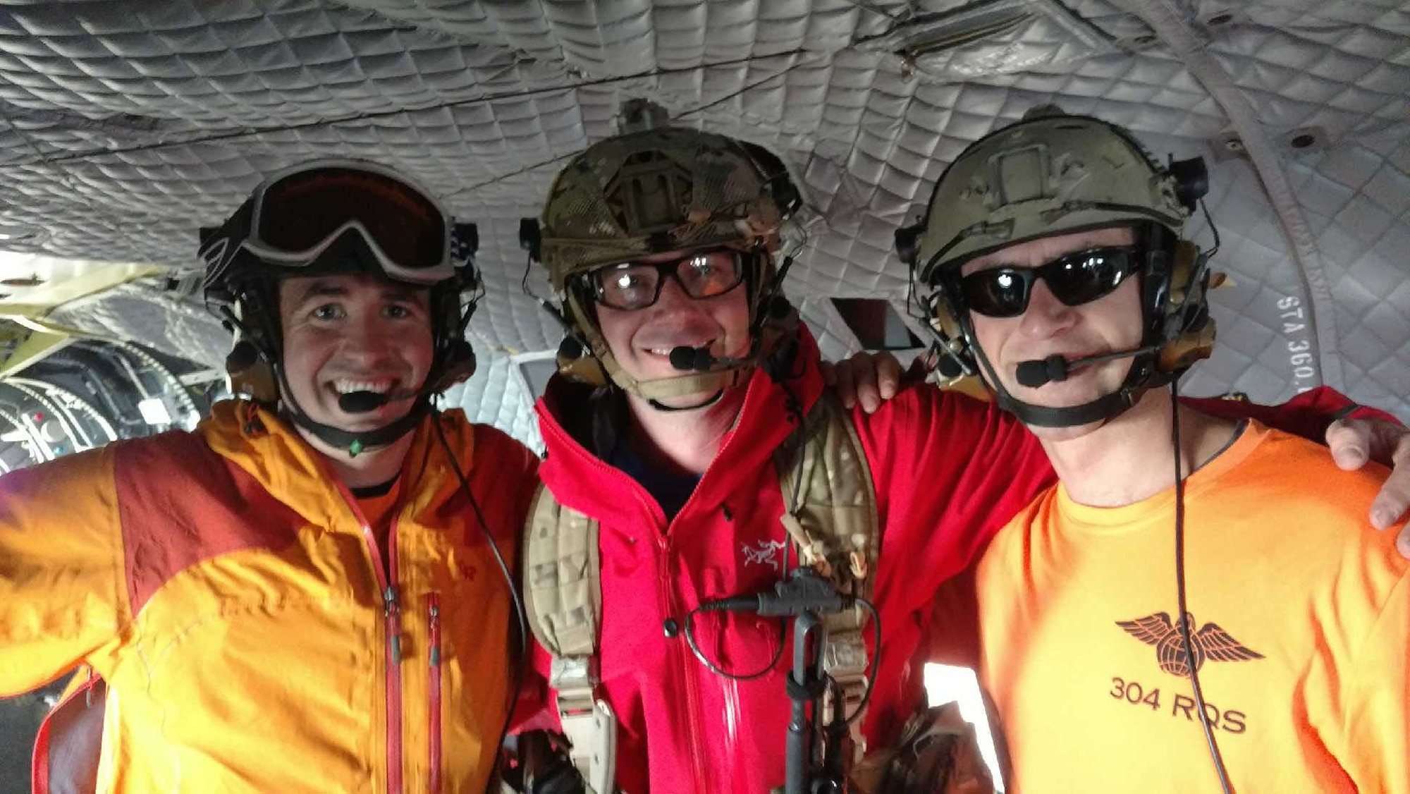 From left to right: Staff Sgts. Kevin and Ross, 304th Rescue Squadron pararescuemen, and Capt. Zachery, 304th RQS  combat rescue officer, pose on board a U.S. Army Reserve CH-47 Chinook rescue helicopter after rescuing a stranded climber on Mount Rainier, Washington. The 304th RQS is a geographically separated unit from the 920th Rescue Wing at Patrick Air Force Base, Florida. (U.S. Air Force courtesy photo)