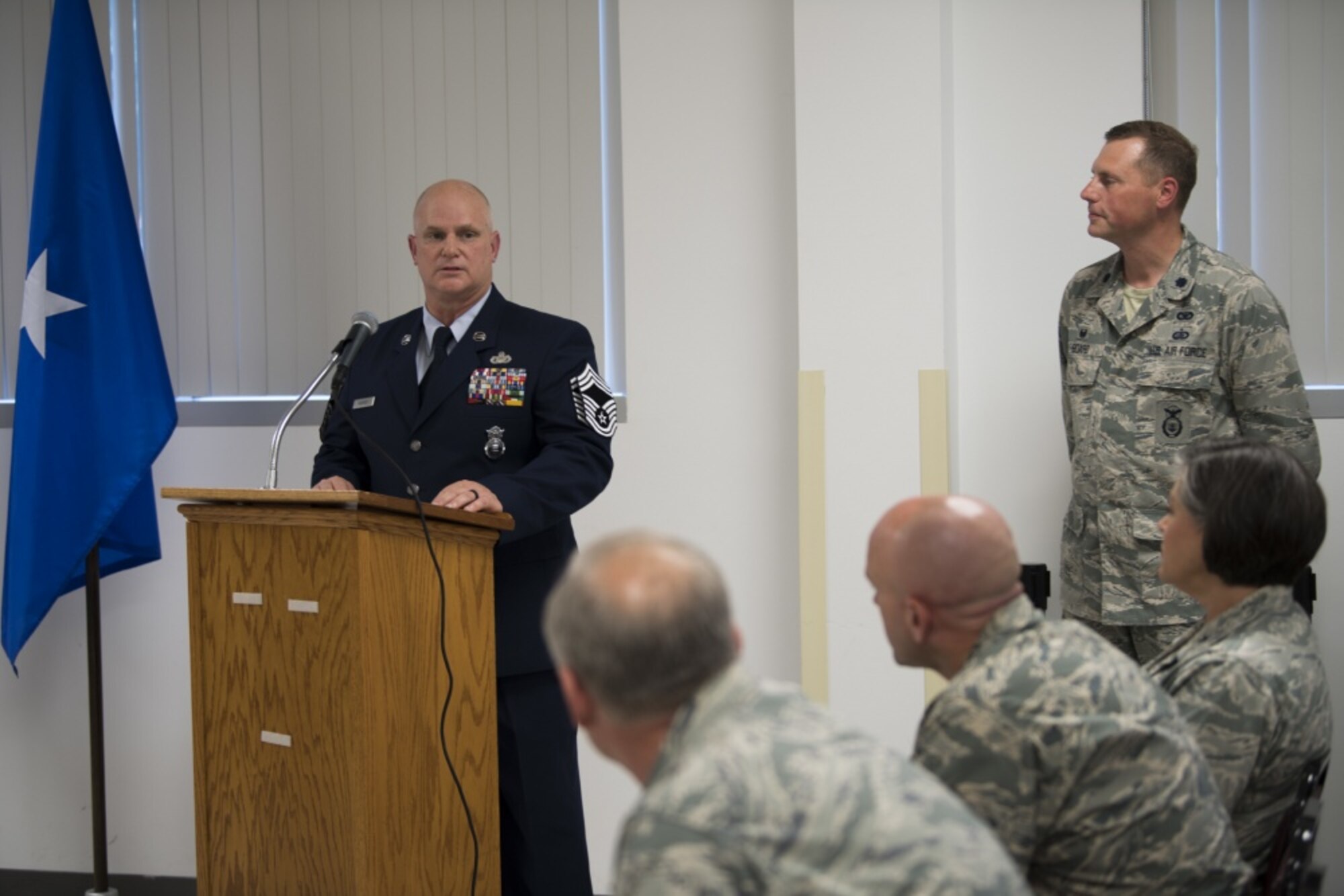 Chief Master Sgt. P. Wayne Hughes speaks to the crowd of Security Forces personnel at his promotion ceremony held June 3, 2017 at McLaughlin Air National Guard Base, Charleston, W.Va. Hughes is a 27-year veteran of Security Forces who will assume the role of chief enlisted manager with this promotion. (U.S. Air National Guard photo by Capt. Holli Nelson)
