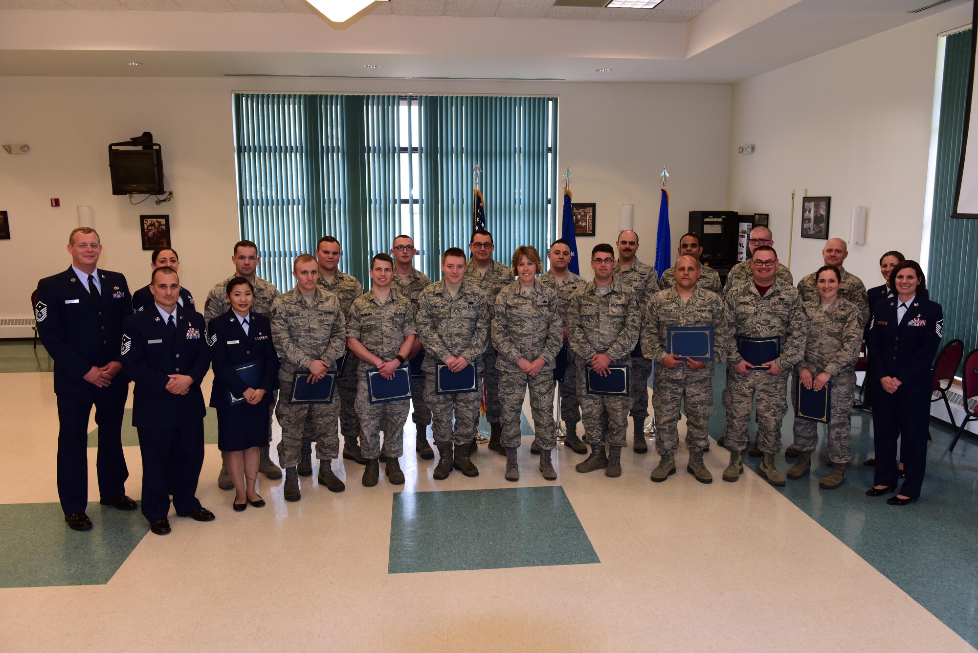 Airmen recognized at the first Non-Commissioned Officer induction ceremony, held at Stratton Air National Guard Base, pose for a group photo, Scotia, New York on June 3, 2017.  The induction ceremony recognizes Airmen who were promoted to staff sergeant between May 1, 2016 and May 15, 2017. More than 30 Airmen were recognized during the ceremony. (U.S. Air National Guard photo by Staff Sgt. Benjamin German/Released)