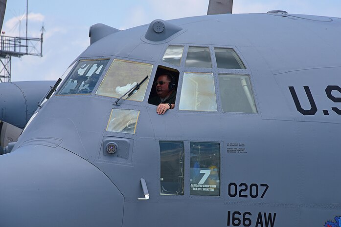 Lt. Col. Arne Kolbjornsen, pilot, 142nd Airlift Squadron, smiles as he finishes his last mission for the Delaware Air National. After 29 years of service and 5335.4 flying hours, family and members from the 166th Airlift Wing came out to congratulate him on his incredible career and thank him for his leadership and friendship at the Delaware Air National Guard Base, New Castle, Del., 31 May 2017. (U.S. Air National Guard photo by SSgt. Andrew Horgan/released)
