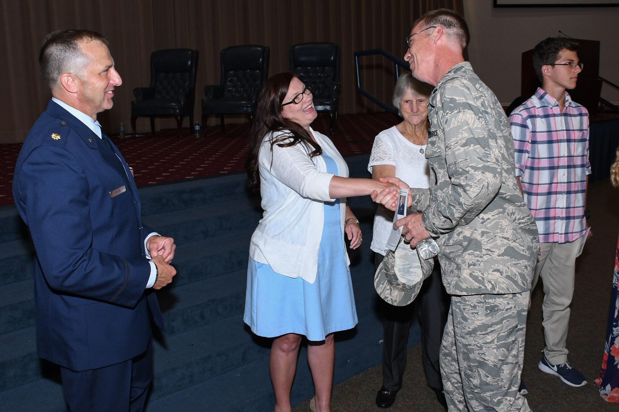U.S. Air Force Maj. Michael Maise, 307th Aircraft Maintenance Squadron commander, and his wife, Destiney, greet Lt. Col. Warren Crabtree, 707th Maintenance Squadron commander, after a change of command ceremony at Barksdale Air Force Base, La., June 3, 2017.   During the ceremony, Maise took command of the 307th AMXS.  He brings a depth of experience to the unit, having served in various capacities as both an enlisted Airman and an officer.  (U.S. Air Force photo by Tech. Sgt. Ted Daigle/Released)