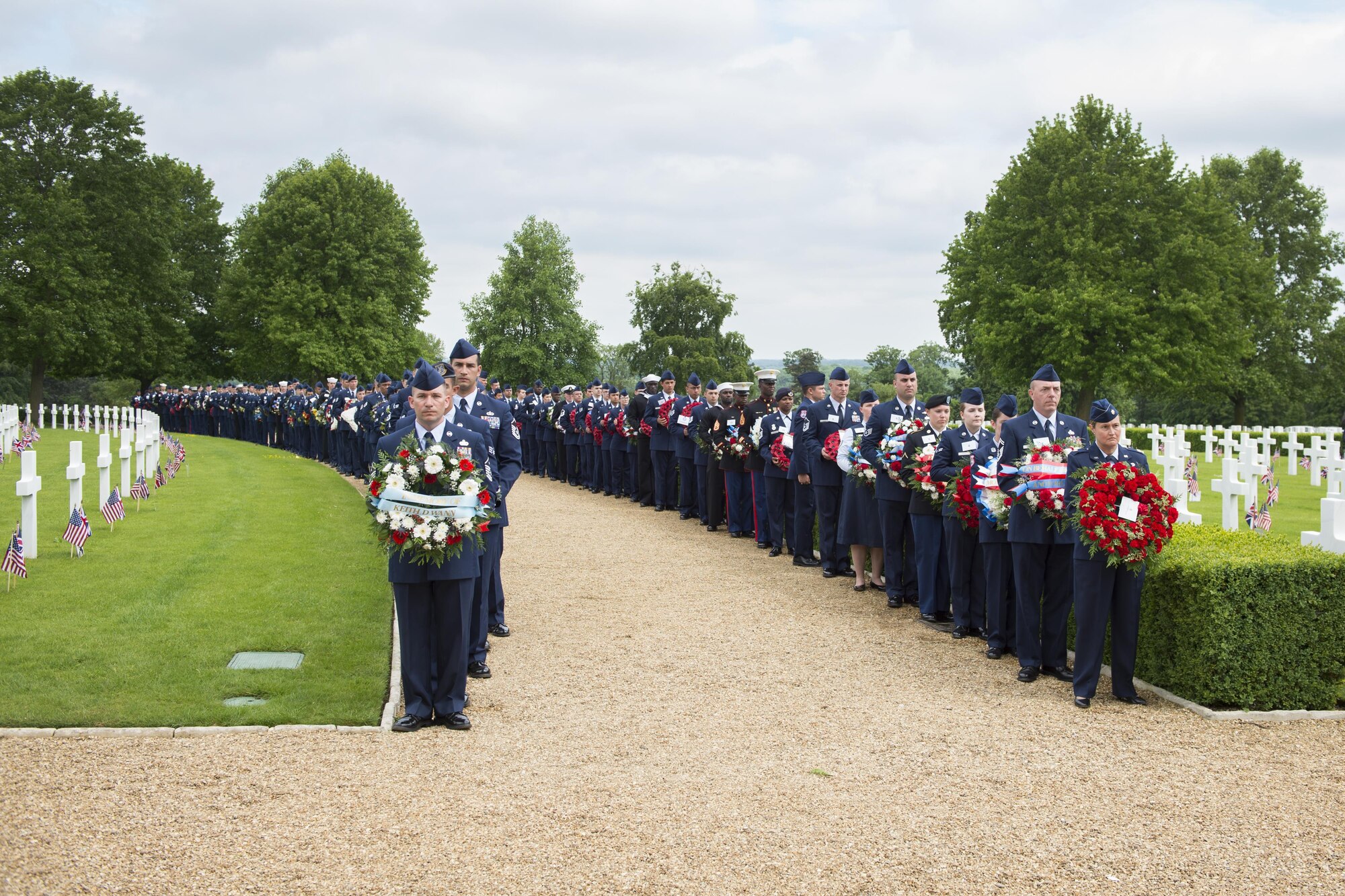 Airmen from the 434th Air Refueling Wing at Grissom Air Reserve Base, Indiana join Airmen from RAF Mildenhall, England to participate in a Memorial Day celebration at the Cambridge American Cemetery in Cambridge, England May 29, 2017. During the ceremony, Airmen gave wreaths to British veterans symbolizing the unity between the two nations. (U.S. Air Force photo/Tech. Sgt. Benjamin Mota)