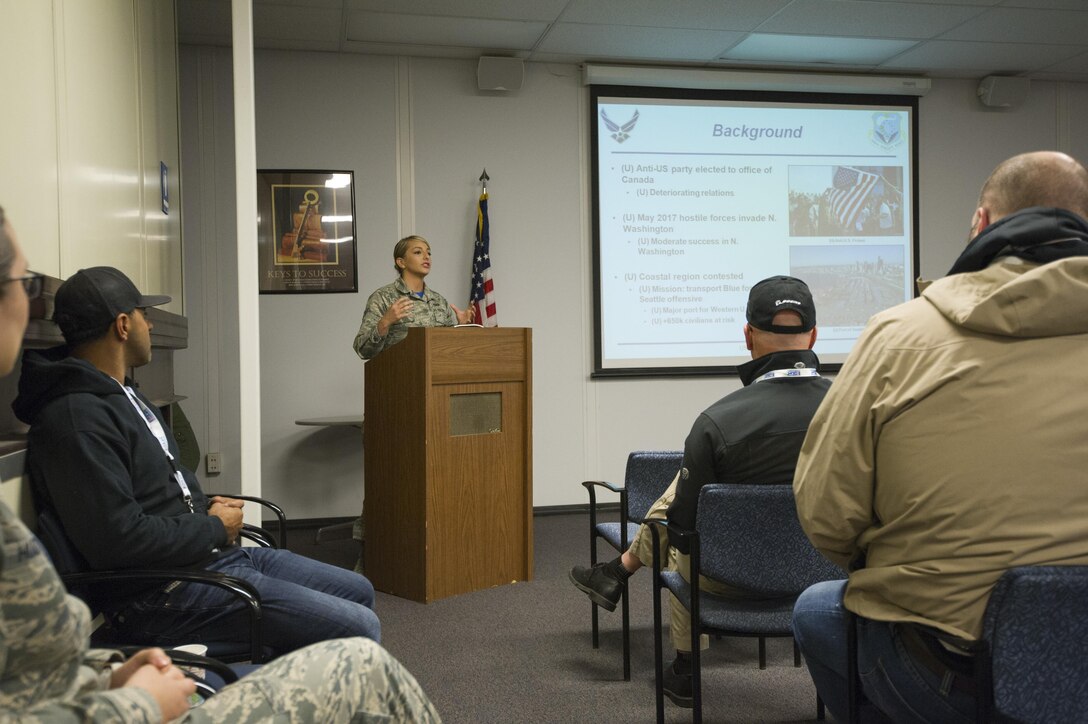 Civilian employers from around the Puget Sound listen in on a mock, pre-deployment briefing at McChord Field June 3, 2017, during Employer Orientation Day. Reservists invited their employers out for a day to learn and experience life in the Air Force Reserve. Employers went through a deployment processing line and took part in a training flight aboard a C-17 Globemaster III, which included an airdrop. (U.S. Air Force photo by Tech. Sgt. Bryan Hull)