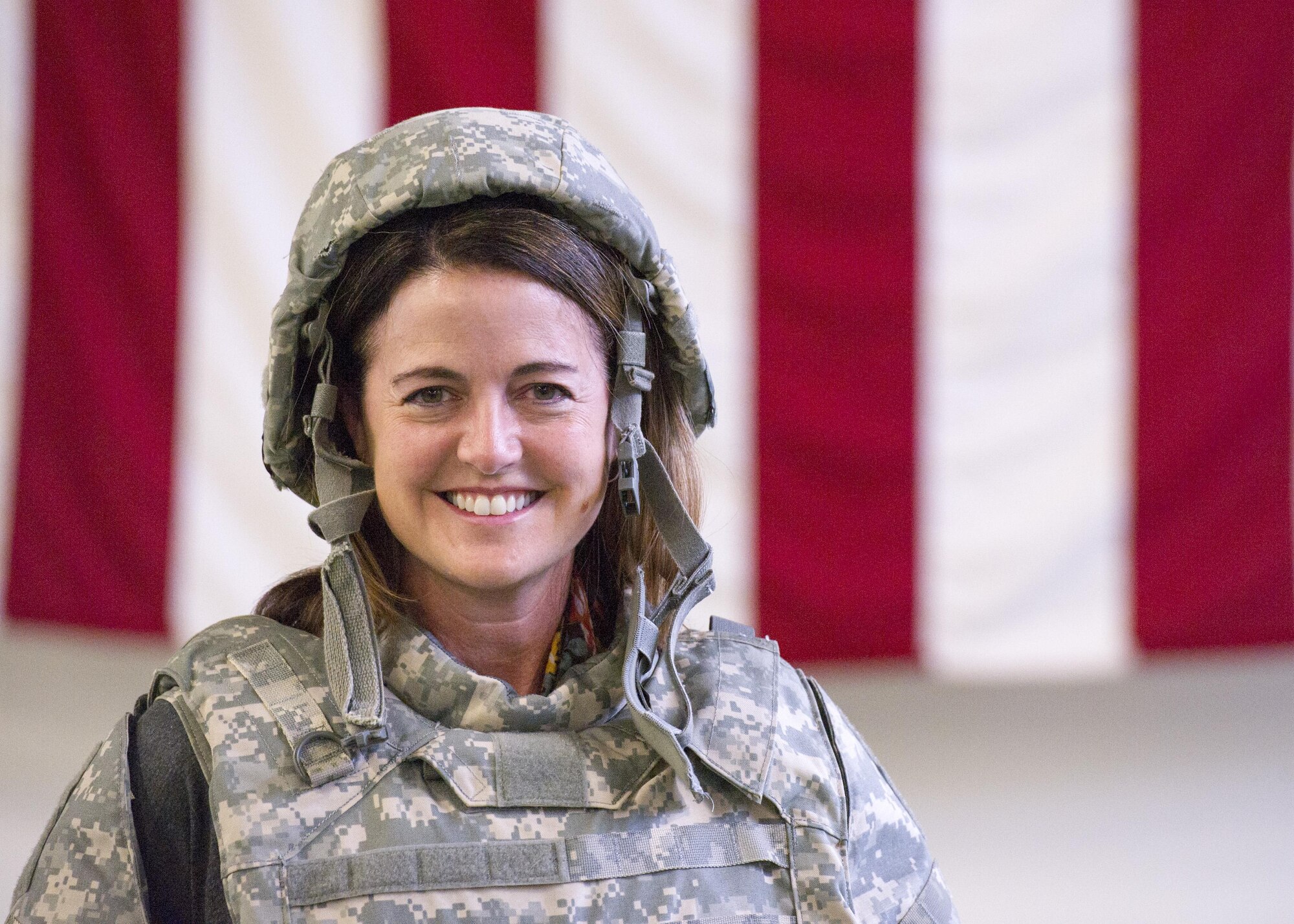 Kristen Kildahl, vice president of human resources at Kaufman Hall and Associates, donned a ballistic helmet and vest at the deployment processing line at McChord Field on June 3, 2017, during Employer Orientation Day. Reservists invited their employers out for a day to learn and experience life in the Air Force Reserve. Employers went through a deployment processing line and took part in a training flight aboard a C-17 Globemaster III, which included an airdrop. (U.S. Air Force photo by Tech. Sgt. Bryan Hull)