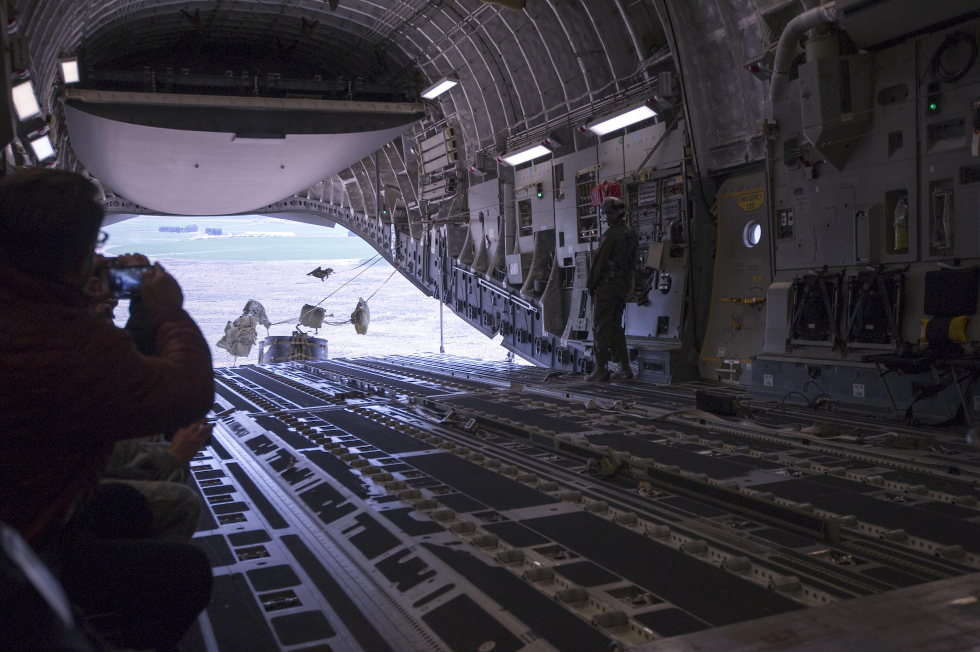 Pallets roll out of the back of a C-17 Globemaster III during an airdrop June 3, 2017, while aboard a training flight as part of Employer Orientation Day at McChord Field. Reservists invited their employers out for a day to learn and experience life in the Air Force Reserve. Employers went through a deployment processing line and took part in a training flight aboard a C-17 Globemaster III, which included an airdrop. (U.S. Air Force photo by Tech. Sgt. Bryan Hull)