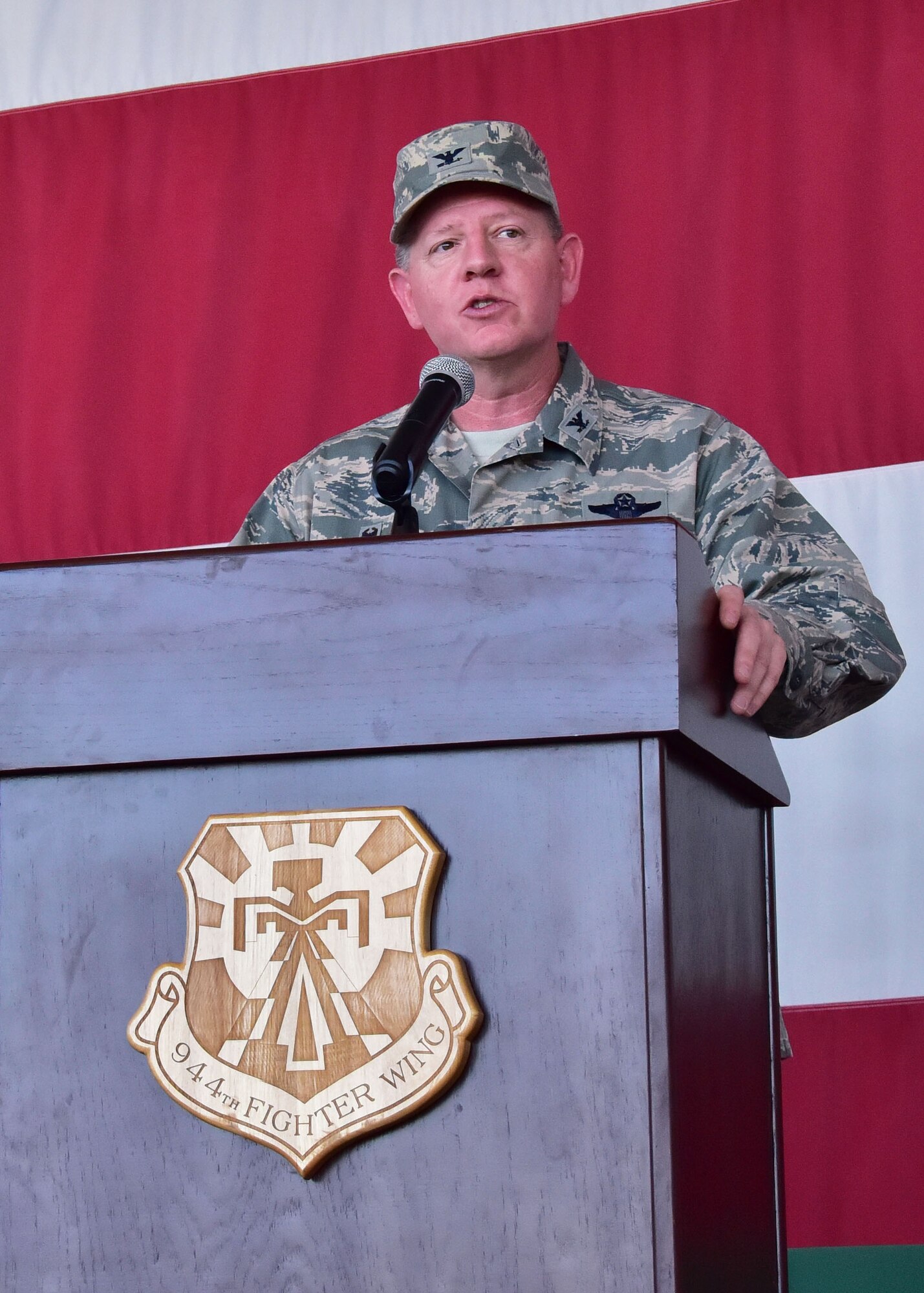 Col. Bryan Cook, 944th Fighter Wing commander, gives a speech June 3 after taking command during a Change-of-Command ceremony at Luke Air Force Base, Ariz. (U.S. Air Force photo by Tech. Sgt. Louis Vega Jr.)