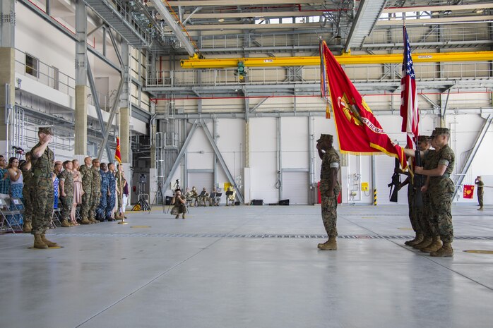 U.S. Marine Corps Lt. Col. Kevin A. Campbell, left, commanding officer of Headquarters and Headquarters Squadron (H&HS), and Sgt. Maj. Darnell Richardson, right, outgoing H&HS sergeant major, pay their respects to colors during a relief and appointment ceremony at Marine Corps Air Station Iwakuni, Japan, June 2, 2017. The relief and appointment ceremony was held to welcome the incoming and see off the outbound sergeant major. (U.S. Marine Corps photo by Lance Cpl. Joseph Abrego)