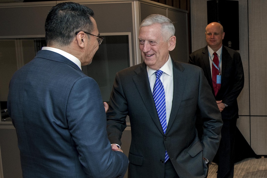 Defense Secretary Jim Mattis greets Malaysian Defense Minister Hishammuddin Tun Hussein during the Shangri-La Dialogue in Singapore, June 4, 2017. DoD photo by Air Force Staff Sgt. Jette Carr