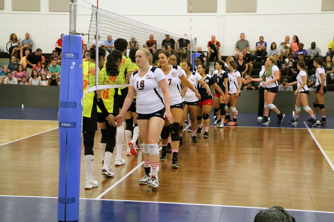 USA and China greet one another as they prepare for the opening match of the 18th Conseil International du Sport Militaire (CISM) World Women's Military Volleyball Championship at Naval Station Mayport, Florida on 4 June 2017. Mayport is hosting the CISM Championship from 2-11 June.  Finals are on 9 June.