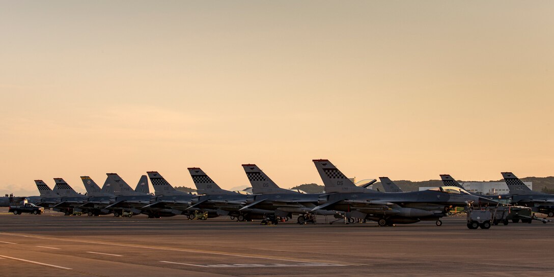 Fifteen F-16 Fighting Falcons assigned to the 36th Fighter Squadron, Osan Air Base, Republic of Korea sit on the flighline at Yokota Air Base, Japan, May 27, 2017. F-16s landed at Yokota en route to Alaska to participate in exercise Red Flag.   (U.S. Air Force photo by Yasuo Osakabe)