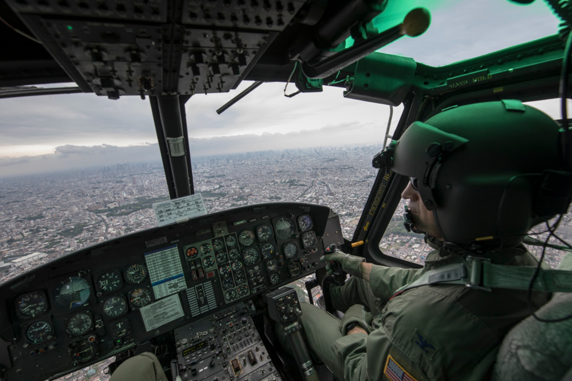 Col. Robert Dotson, 374th Operations Group commander, flies over Tokyo during his fini flight, May 25, 2017. Known as “fini flight,” military aviators have a tradition where after completion of their final flight, aircrew members are met and hosed down with water by their group comrades, family and friends. (U.S. Air Force photo by Yasuo Osakabe)