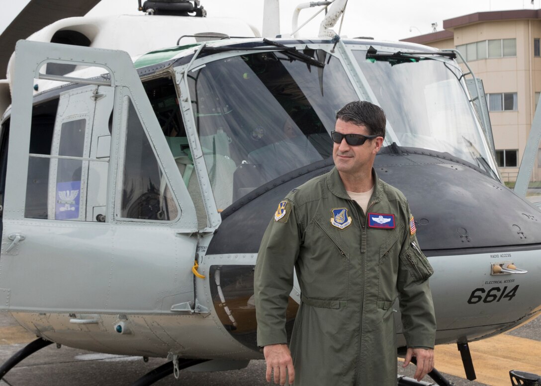 Col. Robert Dotson, 374th Operations Group commander, gets off an UH-1N Iroquois after his fini flight at Yokota Air Base, Japan, May 25, 2017. Dotson made his final flights in a C-12 Huron and an UH-1N Iroquois during that day. (U.S. Air Force photo by Yasuo Osakabe)