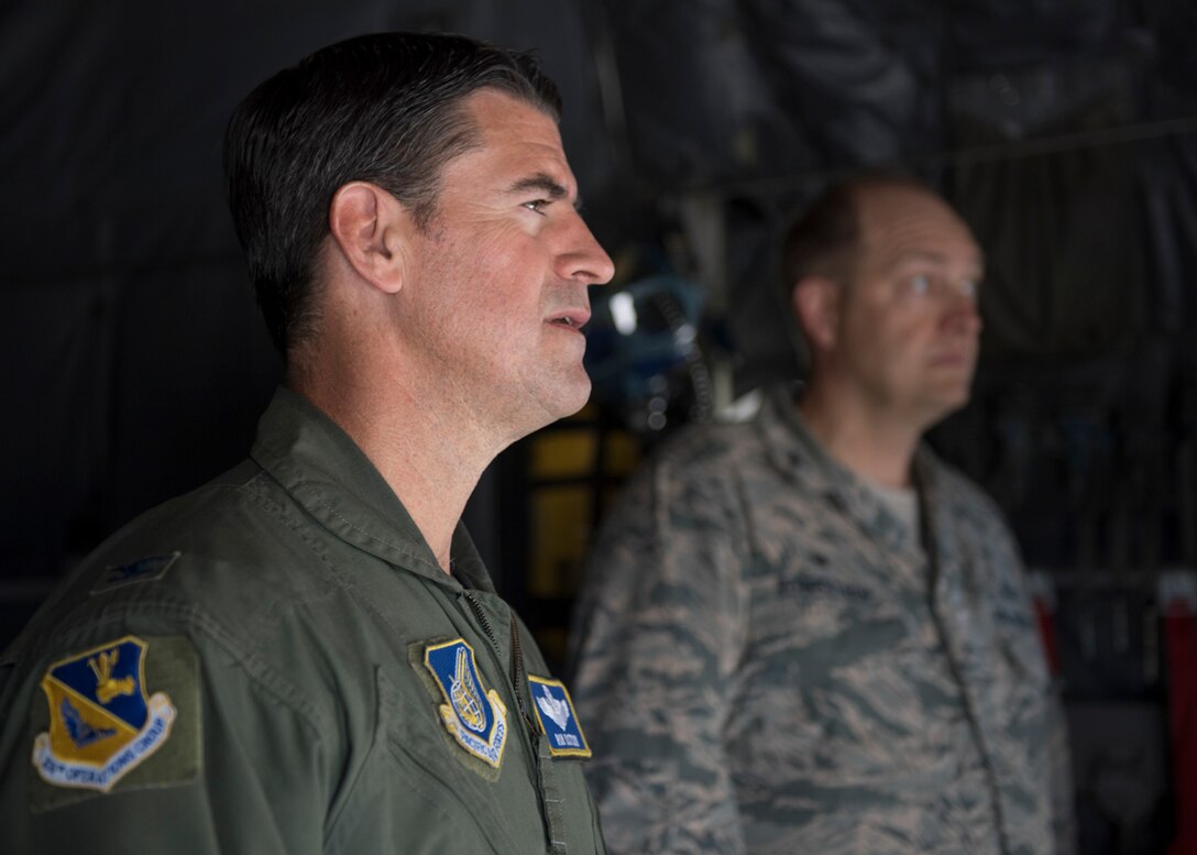 Col. Robert L. Dotson, 374th Operations commander, receives a briefing before his fine flight, June 2, 2017, at Yokota Air Base, Japan. Fini flights follow an Air Force tradition where aircrew members are met and hosed down with water by their group comrades. (U.S. Air Force photo by Airman 1st Class Juan Torres)