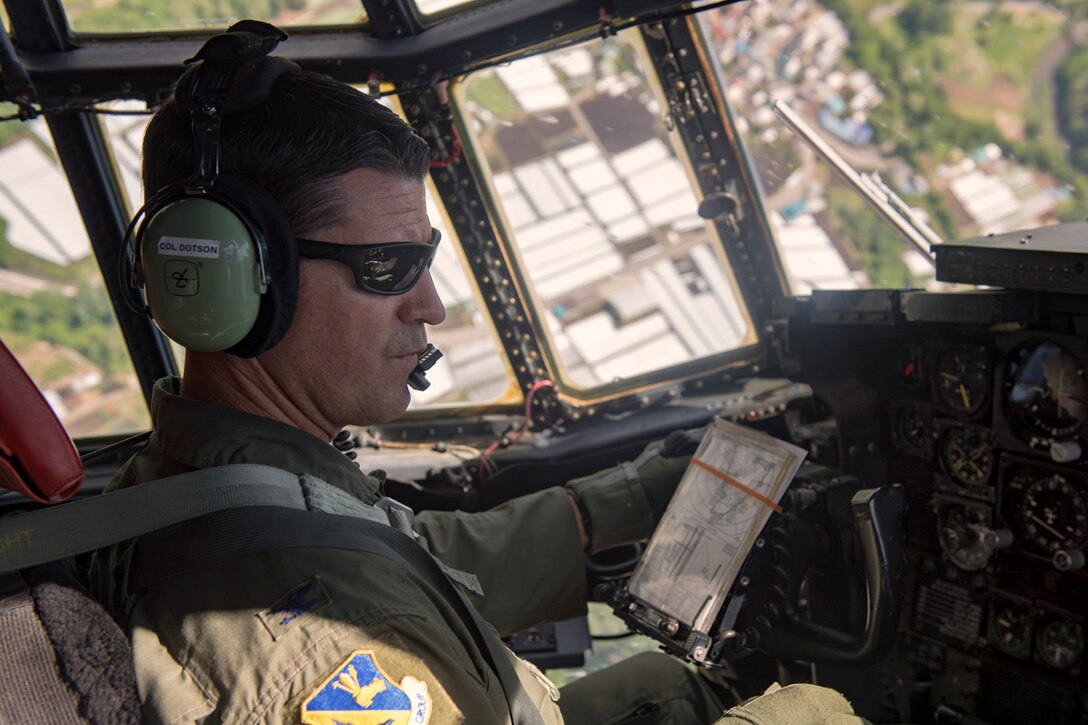 Col. Robert L. Dotson, 374th Operations commander, pilots a C-130H Hercules assigned to Yokota Air Base, June 2, 2017, over the Kanto plain, Japan. Dotson is a command pilot with more than 4,000 flight hours across nine airframes. (U.S. Air Force photo by Airman 1st Class Juan Torres)