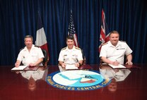 MANAMA, Bahrain (June 1, 2017) From left, Vice Adm. Louis-Michel Guillaume, commander of French Submarine and Strategic Oceanic Forces, Vice Adm. Kevin M. Donegan, commander of U.S. Naval Forces Central Command, and Rear Adm. Robert K. Tarrant, commander Operations, Royal Navy, sign an agreement designed to increase coordination for anti-submarine warfare activities between France, the United States and the United Kingdom. The agreement follows the signing of a trilateral cooperation agreement by Chief of Naval Operations Adm. John Richardson, the First Sea Lord of the United Kingdom Adm. Sir Philip Jones and French Chief of Naval Staff Adm. Christophe Prazuck in London on March 27. (U.S. Navy photo by Mass Communications Specialist 2nd Class Victoria Kinney) 