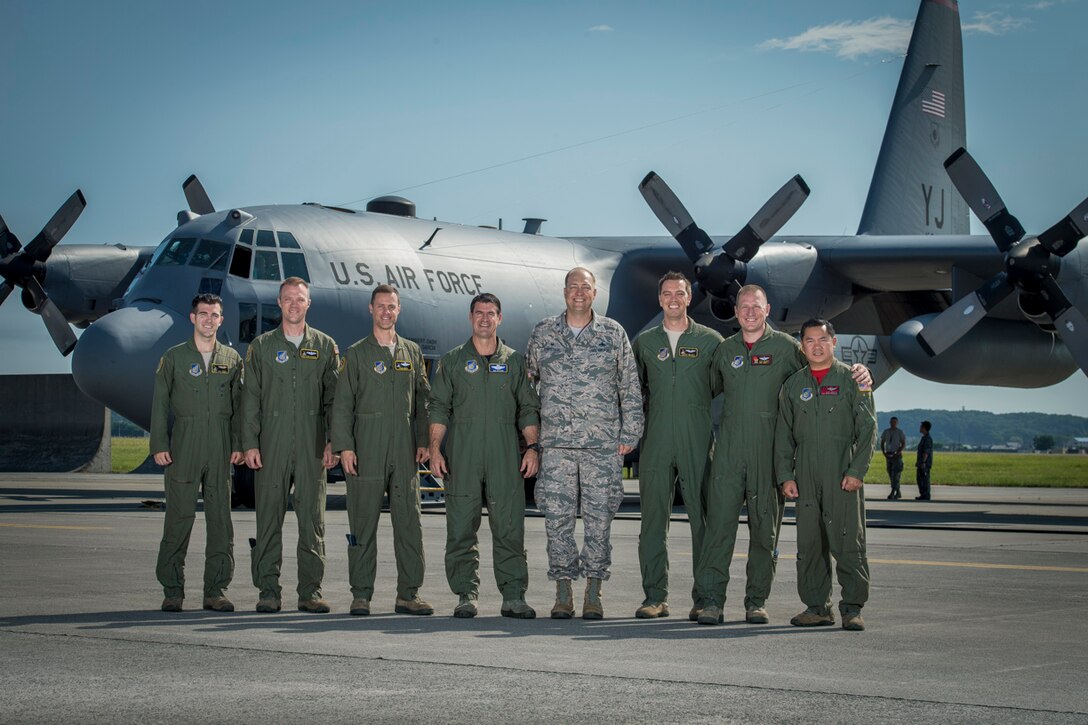 Aircrew pose for photo prior to take off for Col. Robert  Dotson’s, 374th Operations Group commander, fini flight at Yokota Air Base, Japan, June 2, 2017. Known as a “fini” flight, follows an Air Force tradition dating back to WWII where upon completion of an aircrew member’s final flight they are doused with water and congratulated by their comrades in arms and family. (U.S. Air Force photo by Airman 1st Class Donald Hudson)