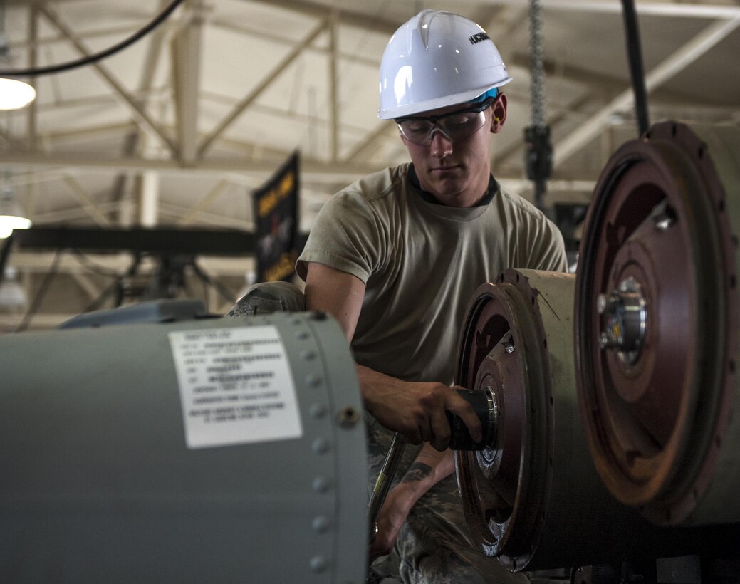 U.S. Air Force Senior Airman Peter Evanciew, 8th Maintenance Squadron conventional maintenance crew member, tightens the internal assembly of a Guided Bomb Unit 31 version 3 during the Combat Ammunition Production Exercise at Kunsan Air Base, Republic of Korea, June 5, 2017. CAPEX is a forum to evaluate total force integration, how well Airmen maintained Air Tasking Order requirements, receipt of munitions and the weapons breakdown process. Approximately 350 Airmen from bases across PACAF as well as two Air National Guard units participated. (U.S. Air Force photo by Senior Airman Colville McFee/Released) 