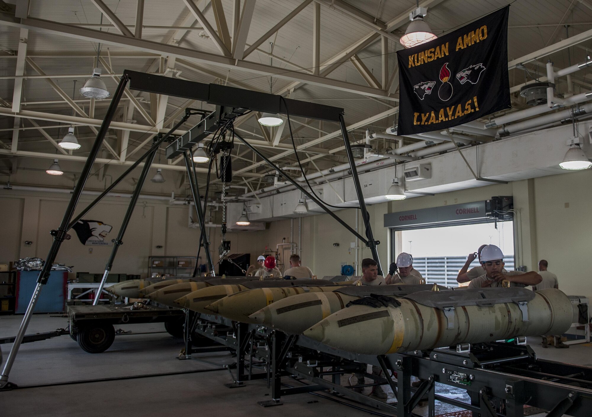 8th Maintenance Squadron conventional maintenance crew members assemble Guided Bomb Unit 31 version 3 during the Combat Ammunition Production Exercise at Kunsan Air Base, Republic of Korea, June 5, 2017. CAPEX involved approximately 350 Airmen who were evaluated on total force integration, how well they maintained Air Tasking Order requirements, receipt of munitions and the weapons breakdown process. (U.S. Air Force photo by Senior Airman Colville McFee/Released)