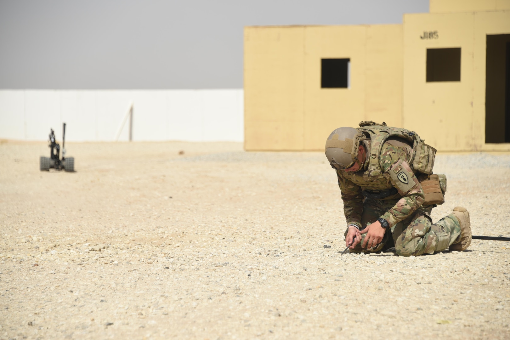 An Army explosive ordnance disposal technician, assigned to the 630th EOD Company, performs counter improvised explosive device techniques during a joint service EOD field training exercise at an undisclosed location in Southwest Asia, May 23, 2017. EOD teams from each of the four service branches, deployed to five different countries across the AOR, gathered for joint service EOD training, which allowed for the exchange of tactics, techniques and procedures between service branches. (U.S. Air Force photo/Tech. Sgt. Jonathan Hehnly)