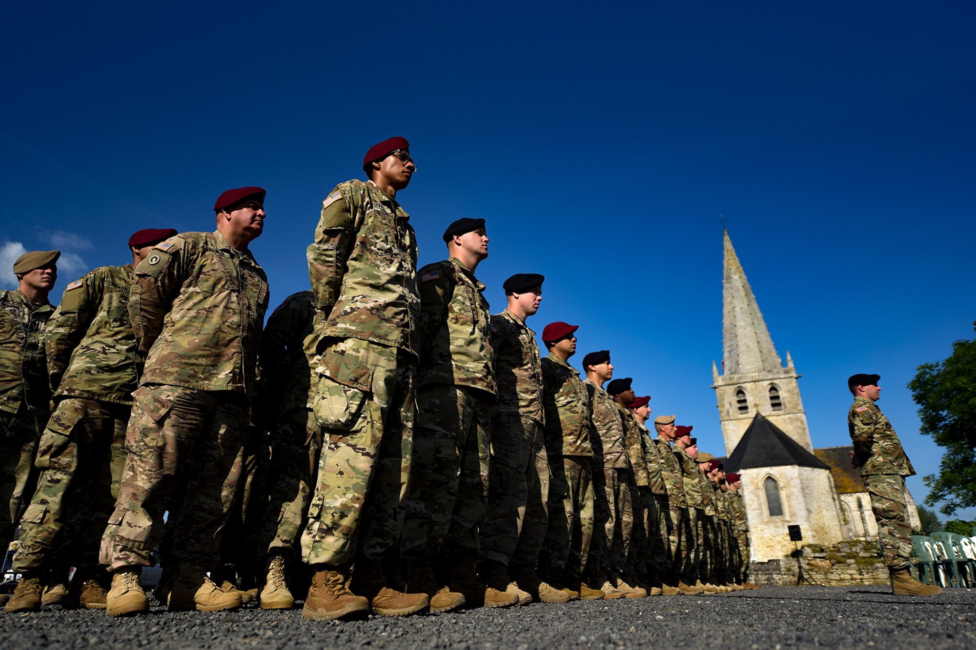 The U.S. Army 173rd Brigade Combat Team from Vicenza, Italy, stands in formation during a D-Day remembrance ceremony at the United States Army Air Forces Transport Memorial in Picauville, France, June 1, 2017. This event commemorates the 73rd anniversary of D-Day, the largest multinational amphibious landing and operational military airdrop in history, and highlights the U.S.' steadfast commitment to European allies and partners. Overall, approximately 400 U.S. service members from units in Europe and the U.S. are participating in ceremonial D-Day 73 events from May 31-June 7, 2017. (U.S. Air Force photo by Senior Airman Devin Boyer)