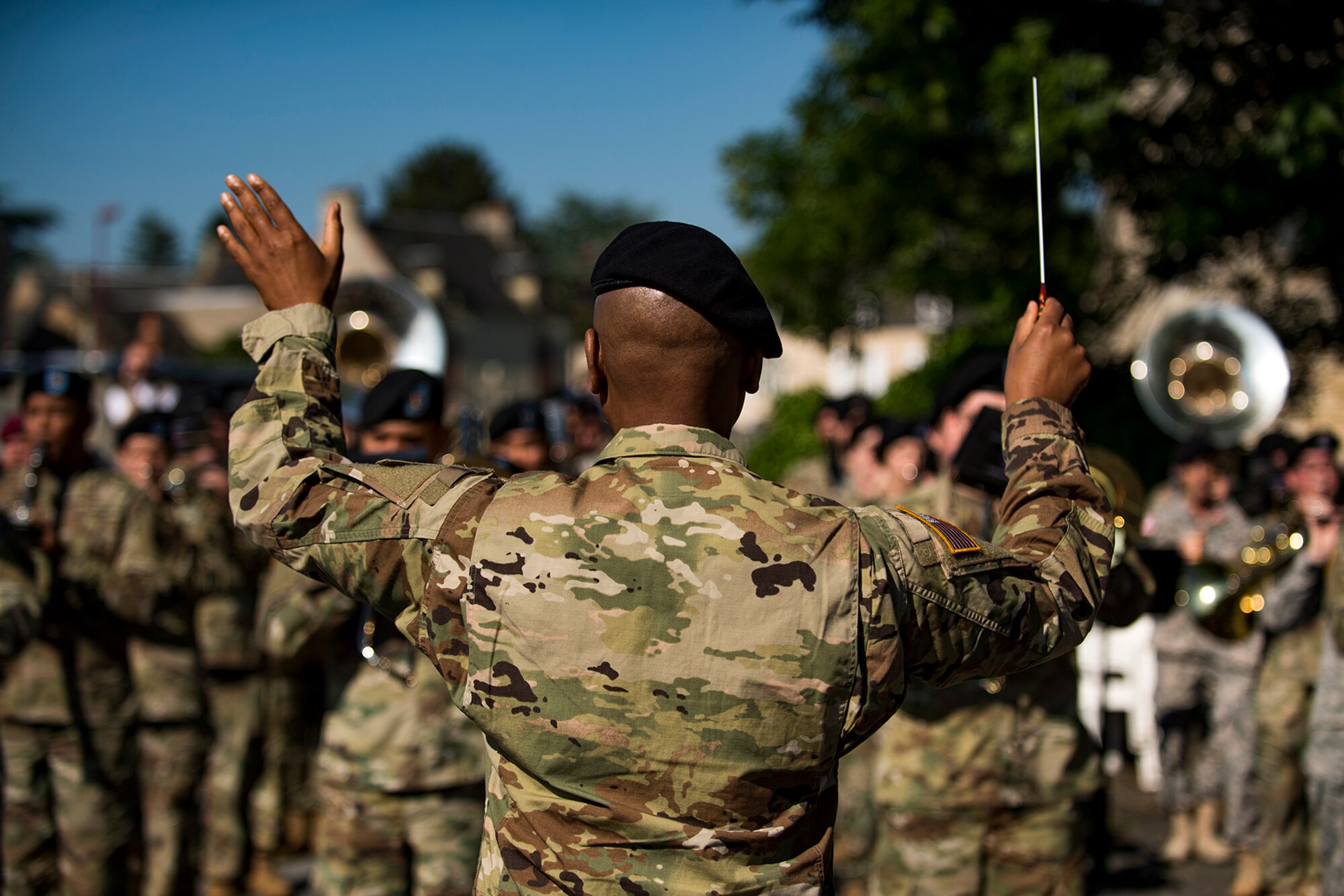 U.S. Army Maj. Dwayne Milburn, U.S. Army Europe Band commander, conducts the National Anthem during a D-Day remembrance ceremony at the United States Army Air Forces Transport Memorial in Picauville, France, June 1, 2017. This event commemorates the 73rd anniversary of D-Day, the largest multinational amphibious landing and operational military airdrop in history, and highlights the U.S.' steadfast commitment to European allies and partners. Overall, approximately 400 U.S. service members from units in Europe and the U.S. are participating in ceremonial D-Day 73 events from May 31-June 7, 2017. (U.S. Air Force photo by Senior Airman Devin Boyer)
