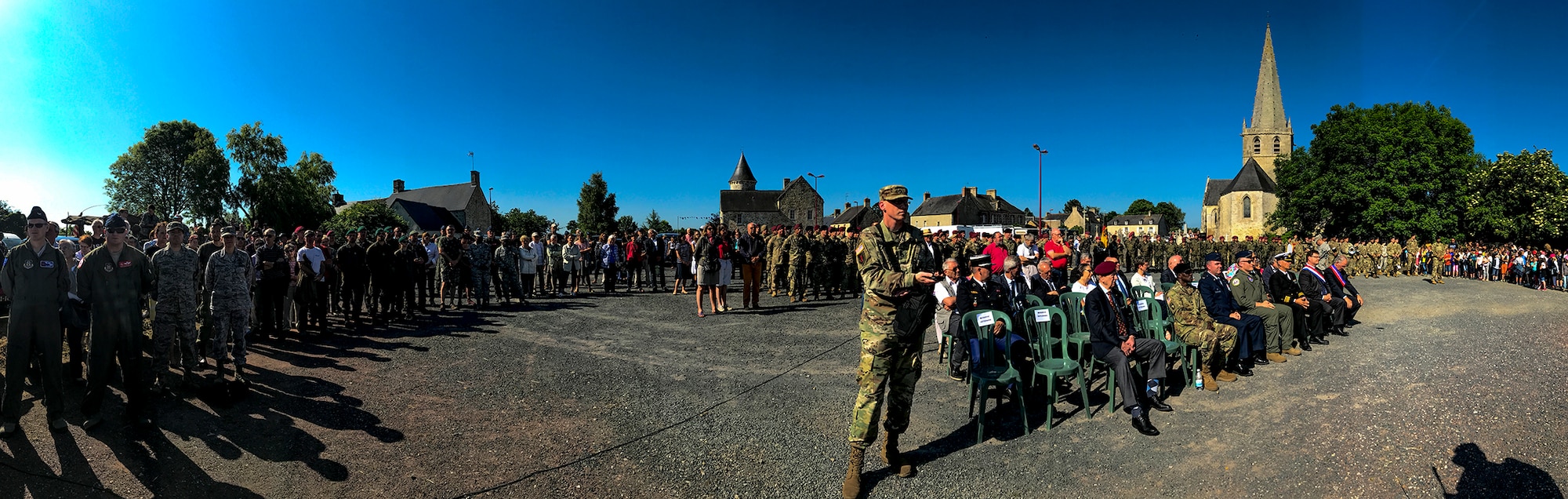Service members and French citizens gather for a D-Day remembrance ceremony at the United States Army Air Forces Transport Memorial in Picauville, France, June 1, 2017. The ceremony began with a speech honoring those who served in World War II and ended with a flyover that included four C-130J Super Hercules aircraft. This event commemorates the 73rd anniversary of D-Day, the largest multinational amphibious landing and operational military airdrop in history, and highlights the U.S.' steadfast commitment to European allies and partners. Overall, approximately 400 U.S. service members from units in Europe and the U.S. are participating in ceremonial D-Day 73 events from May 31-June 7, 2017. (U.S. Air Force photo by Senior Airman Devin Boyer) 