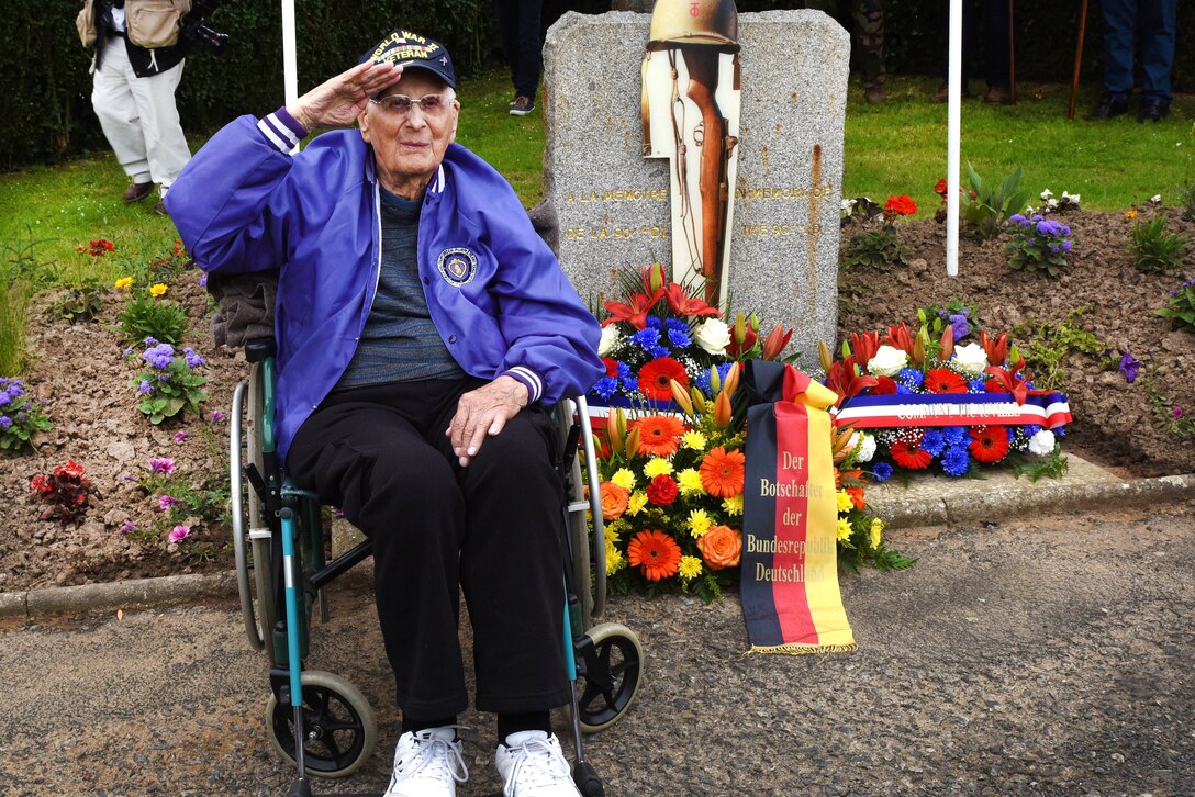 Milton Staley, a World War II veteran, salutes the audience in front of the 90th Infantry Division Monument commemoration ceremony in Picauville, France, June 2, 2017. Army photo by Staff Sgt. Tamika Dillard