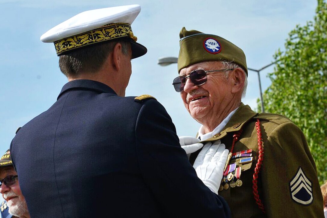 George K. Mullins, a D-Day veteran who participated in the liberation of Carentan, receives a medal during a ceremony in Carentan, France, June 2, 2017. Air Force photo by Airman 1st Class Alexis C. Schultz