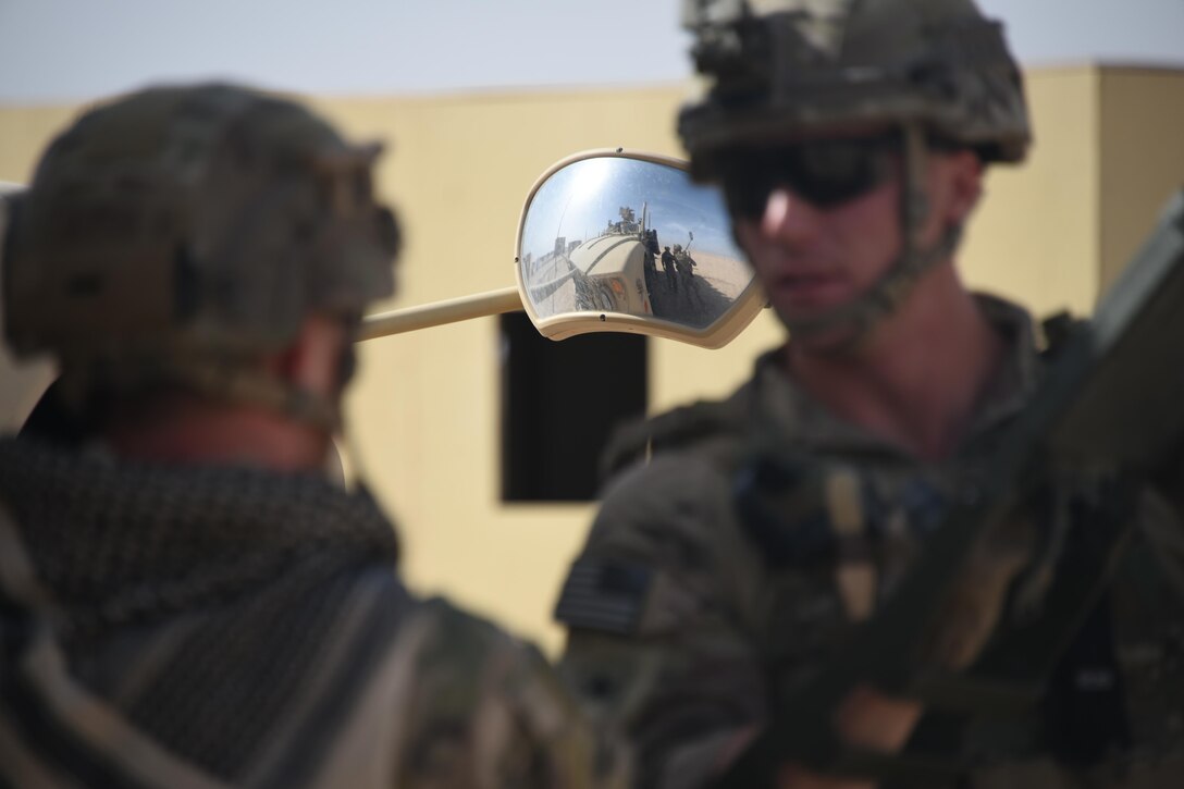 Two Air Force explosive ordnance disposal technicians, discuss counter improvised explosive device tactics, during a joint service EOD field training exercise at an undisclosed location in Southwest Asia, May 23, 2017. EOD teams from each of the four service branches, deployed to five different countries across the AOR, gathered for joint service EOD training, which allowed for the exchange of tactics, techniques and procedures between service branches. (U.S. Air Force photo/Tech. Sgt. Jonathan Hehnly)